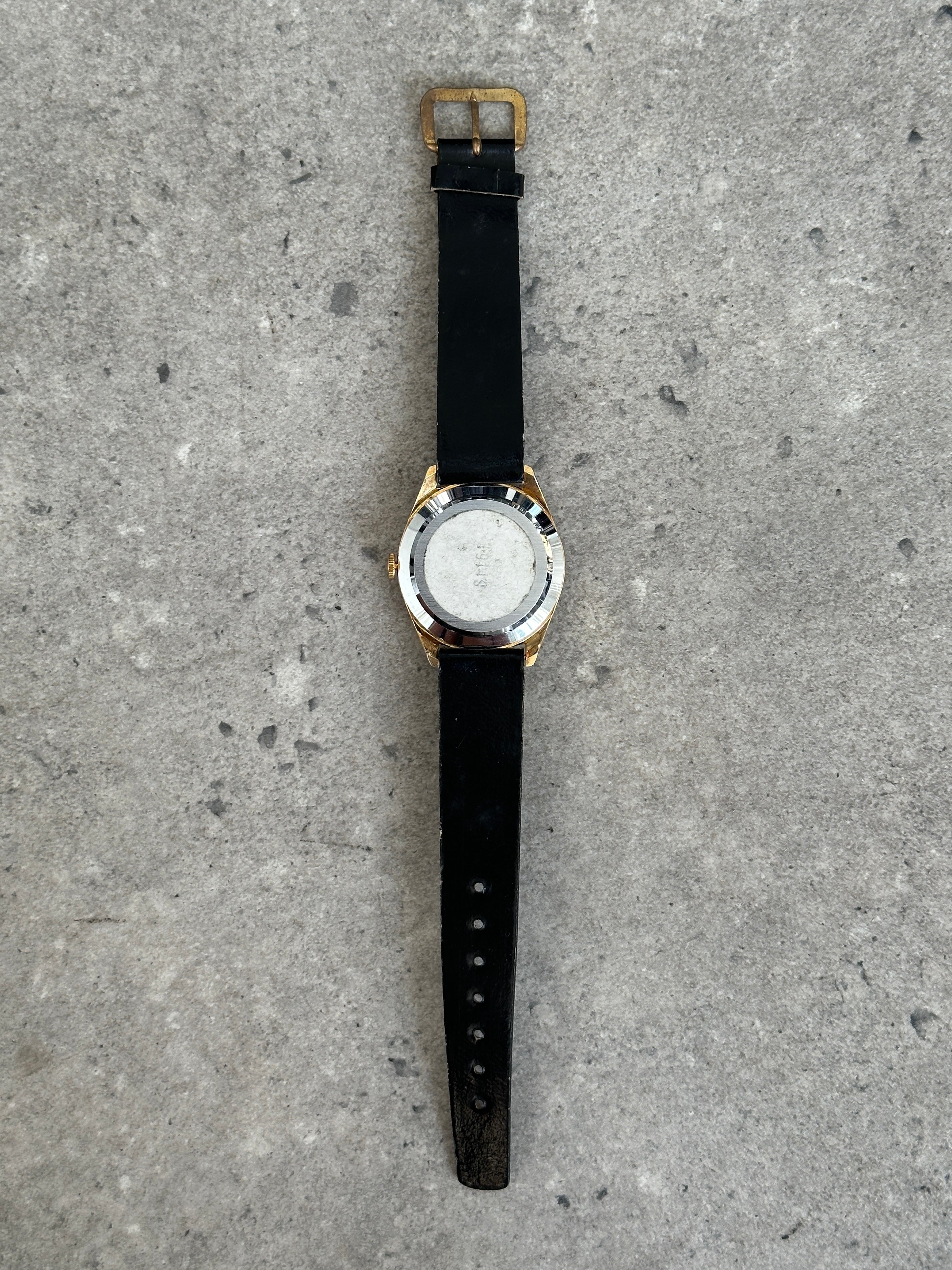 Vintage Swiss Made 1980s mechanical leather watch with classic design and detailed dial.