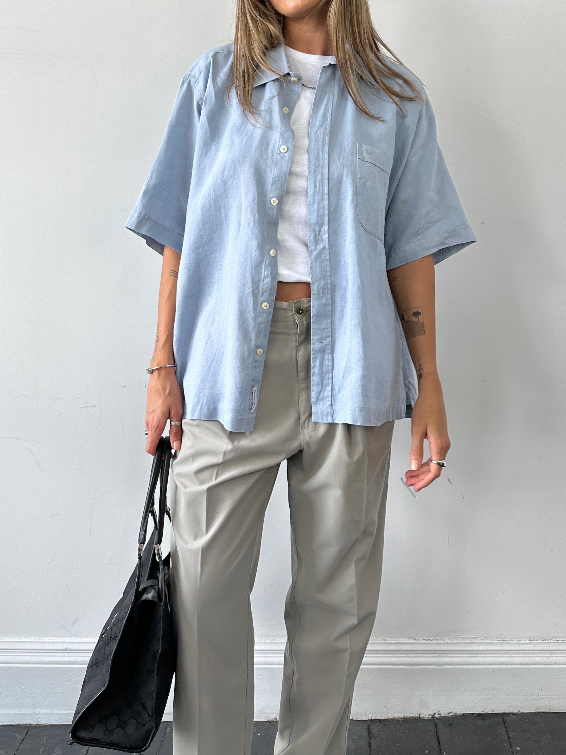 Vintage straight leg pleated relaxed trousers in size W32, featuring classic design and comfortable fit, shown in the image.