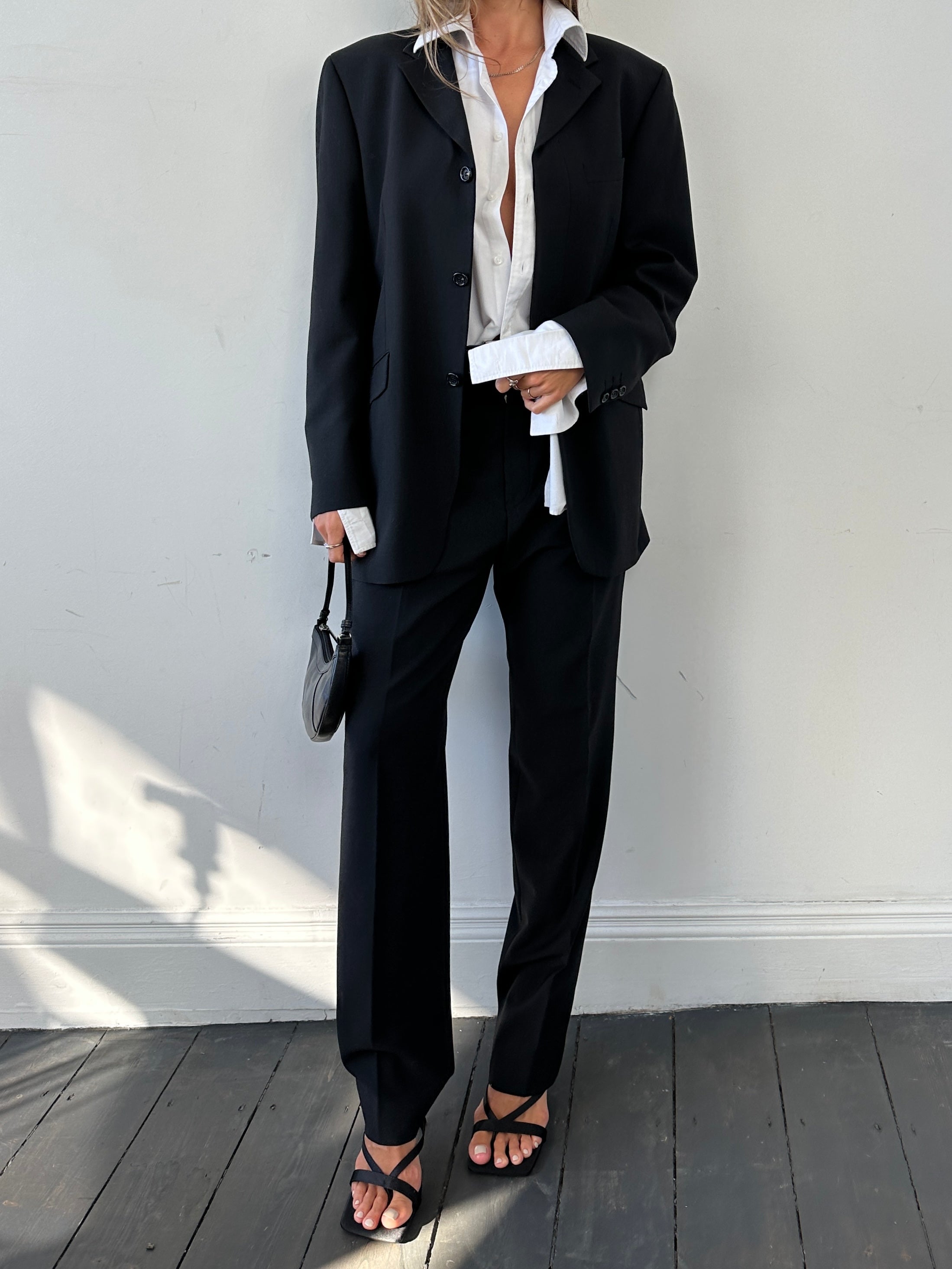Vintage relaxed suit jumpsuit with concealed placket in size 40R/L, featuring a vintage-inspired design and comfortable fit.