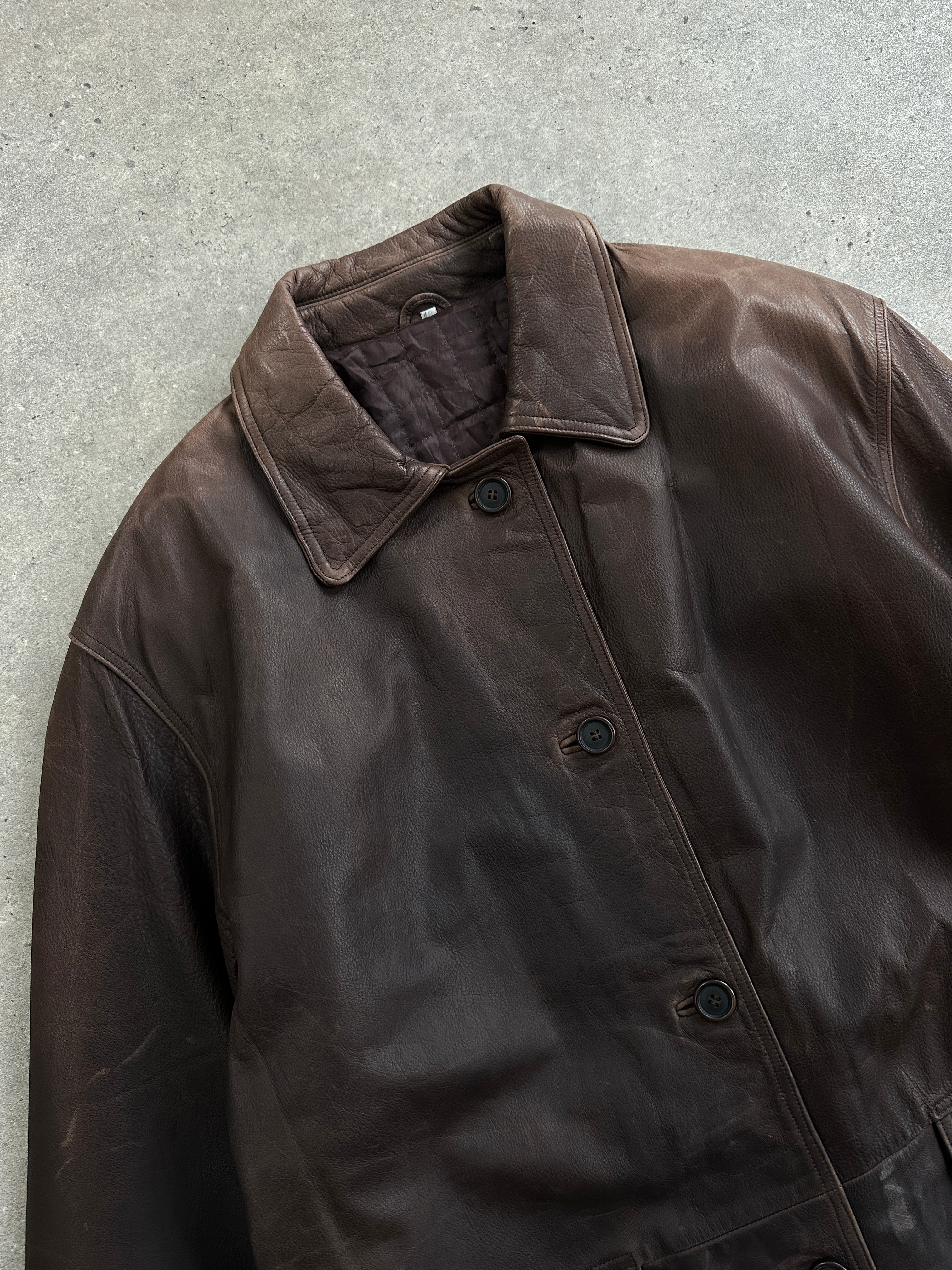Vintage Italian 1990s aged leather jacket with belt, XL size, featuring classic styling and distressed leather details.