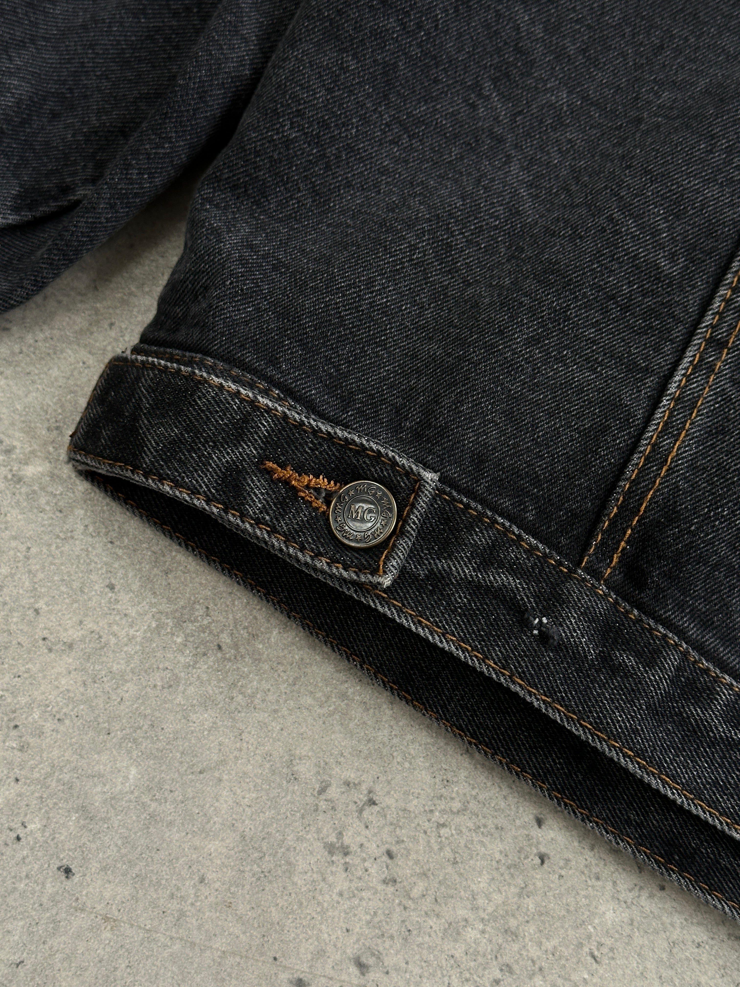 Vintage oversized washed denim jacket in XXL, showcasing classic blue denim with distressed details and relaxed fit.