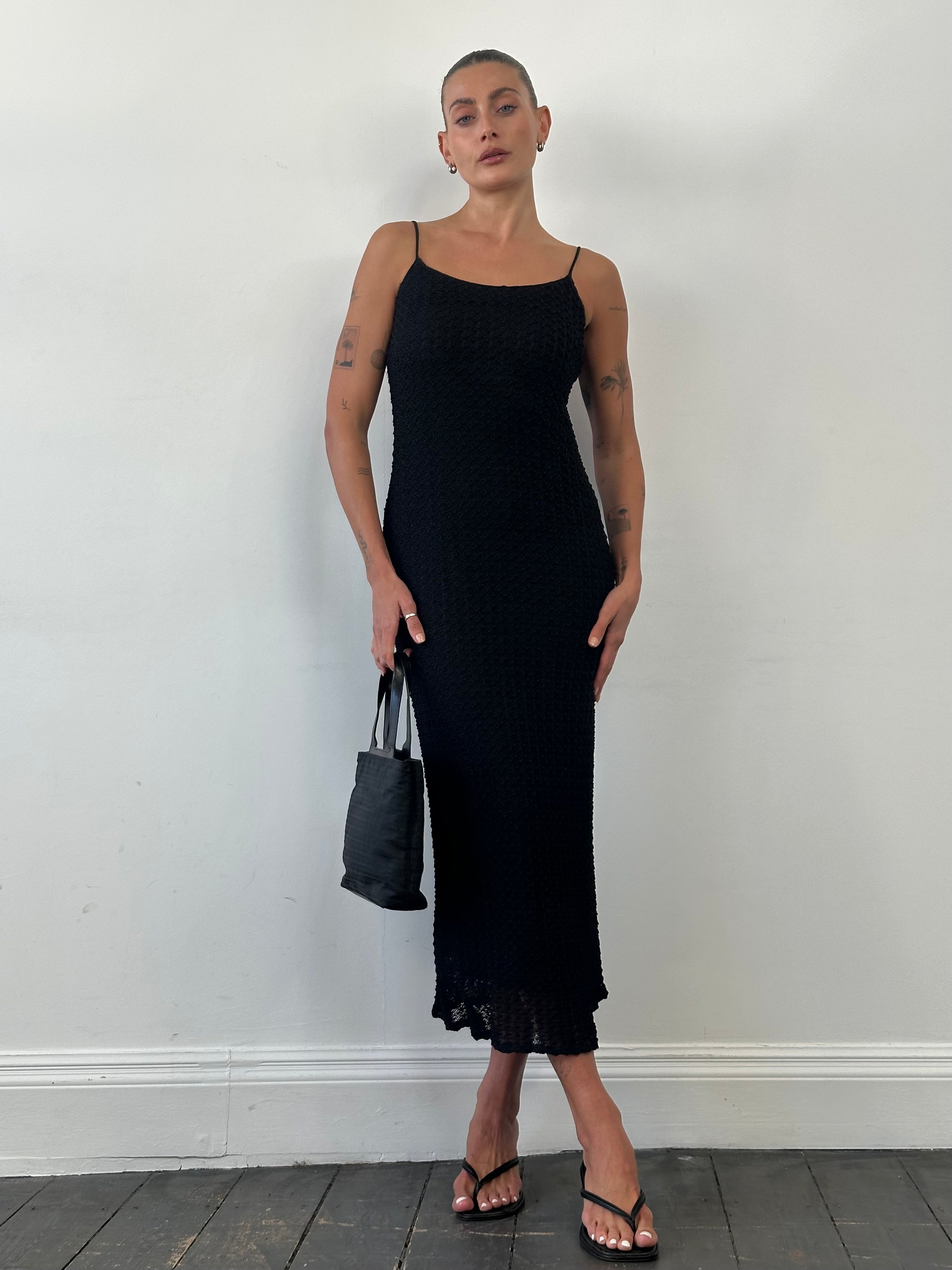 American Vintage textured maxi dress in size small featuring a flowing silhouette and subtle fabric details.