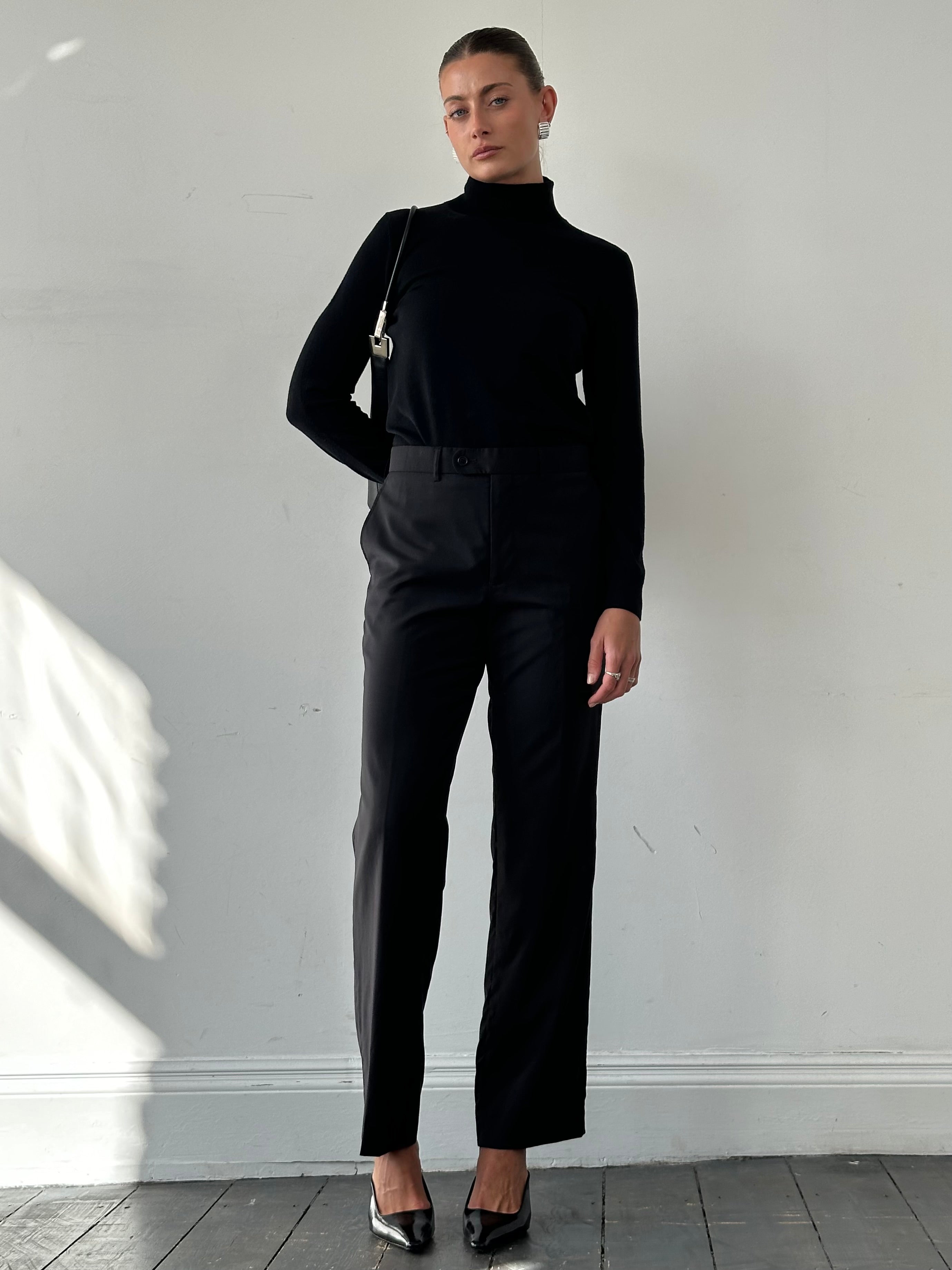 Vintage wool high waisted straight leg tailored trousers in W30, showing the classic fit and textured fabric.