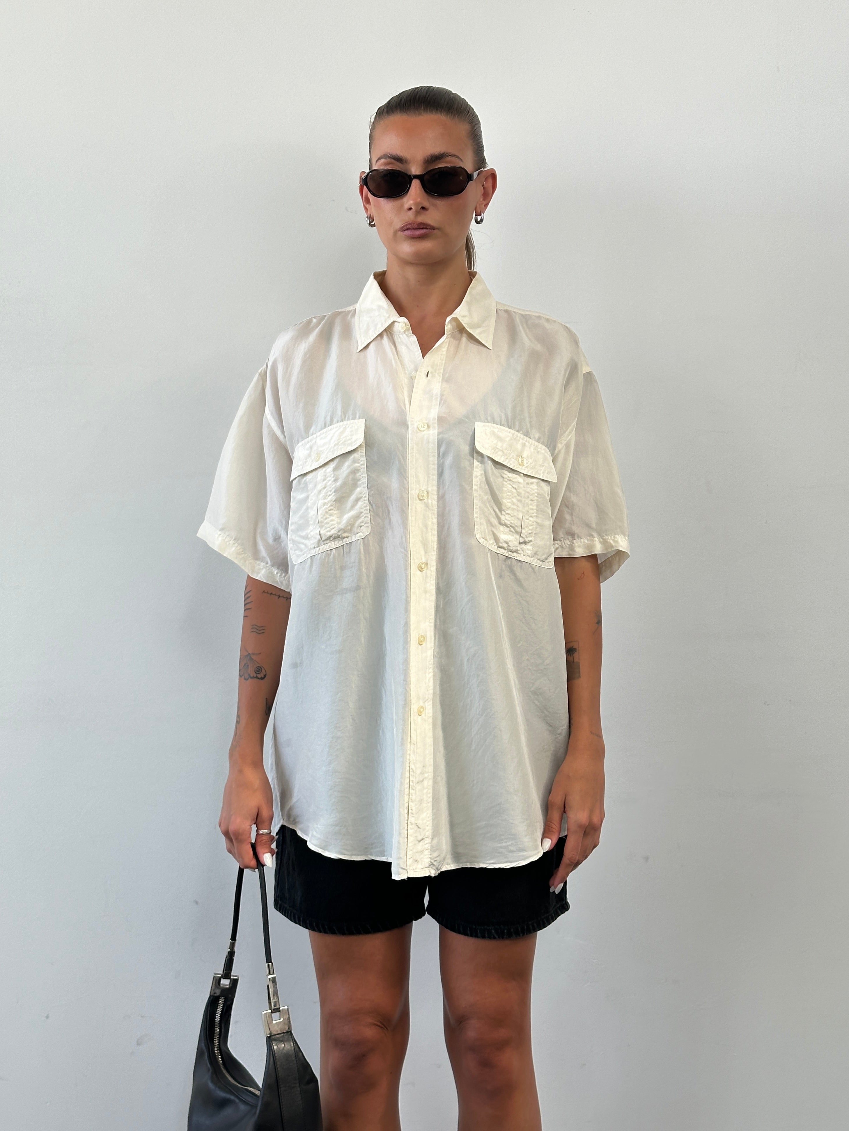 Vintage pure silk short sleeve shirt in XL with a classic design, showcasing smooth fabric and tailored fit.
