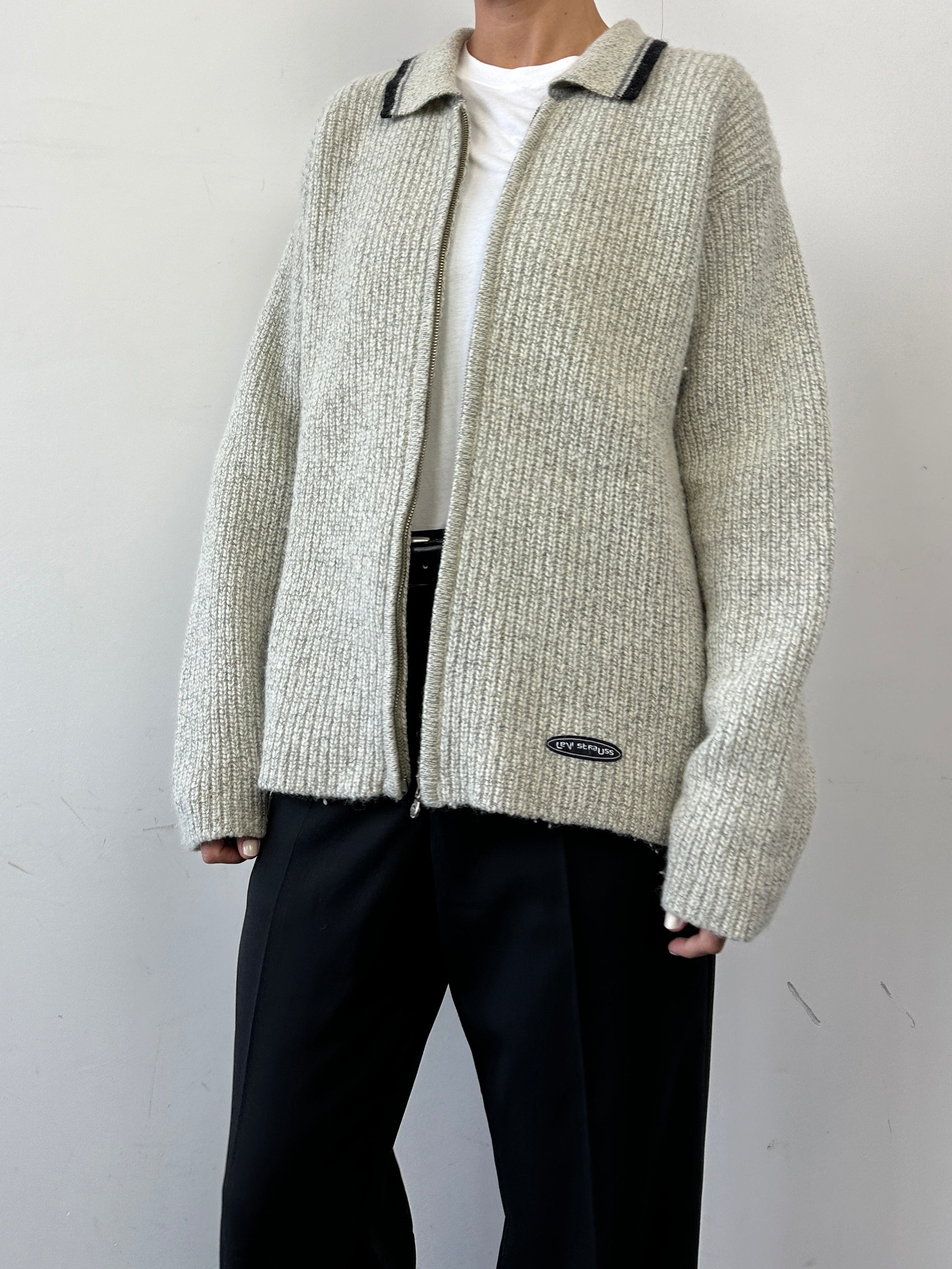 Levi’s wool zip-up knitted cardigan in size L, featuring a cozy, textured design with a front zipper closure.
