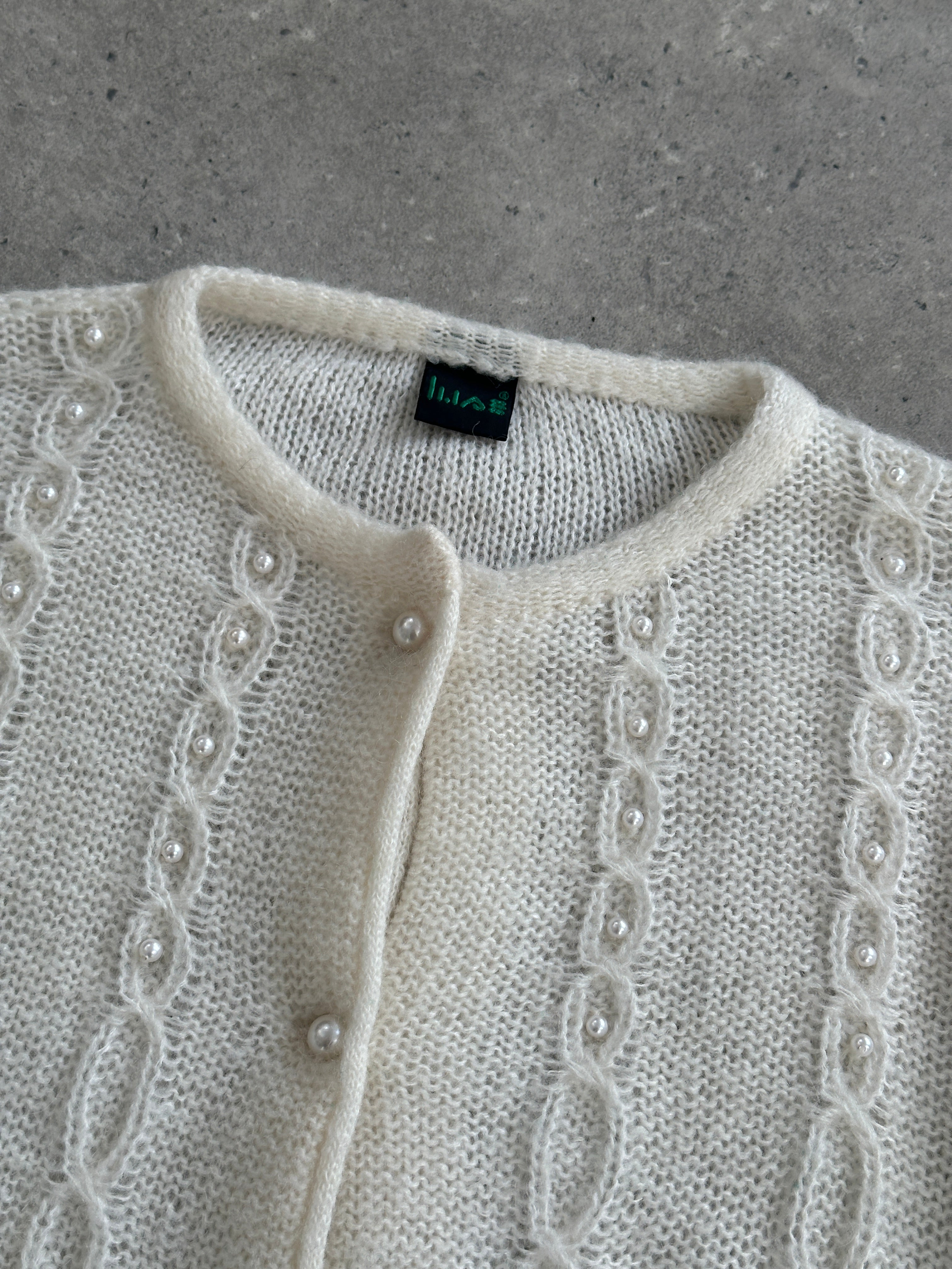 Vintage Italian 1980s mohair knitted cardigan in size M, featuring a cozy, textured knit pattern and classic retro style.
