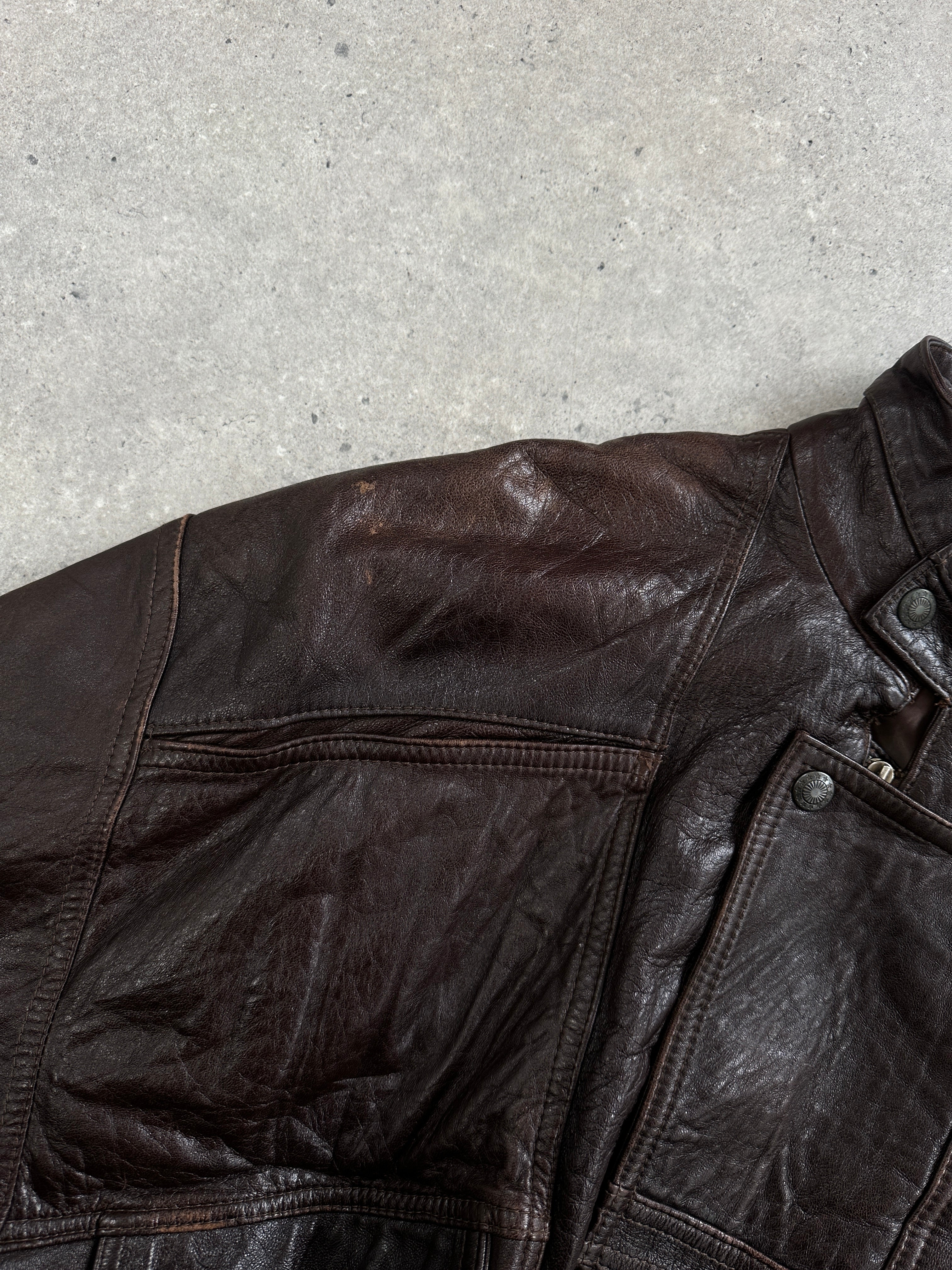 Vintage 1970s high neck moto leather bomber jacket in XL, featuring classic black leather with quilted shoulder detail.