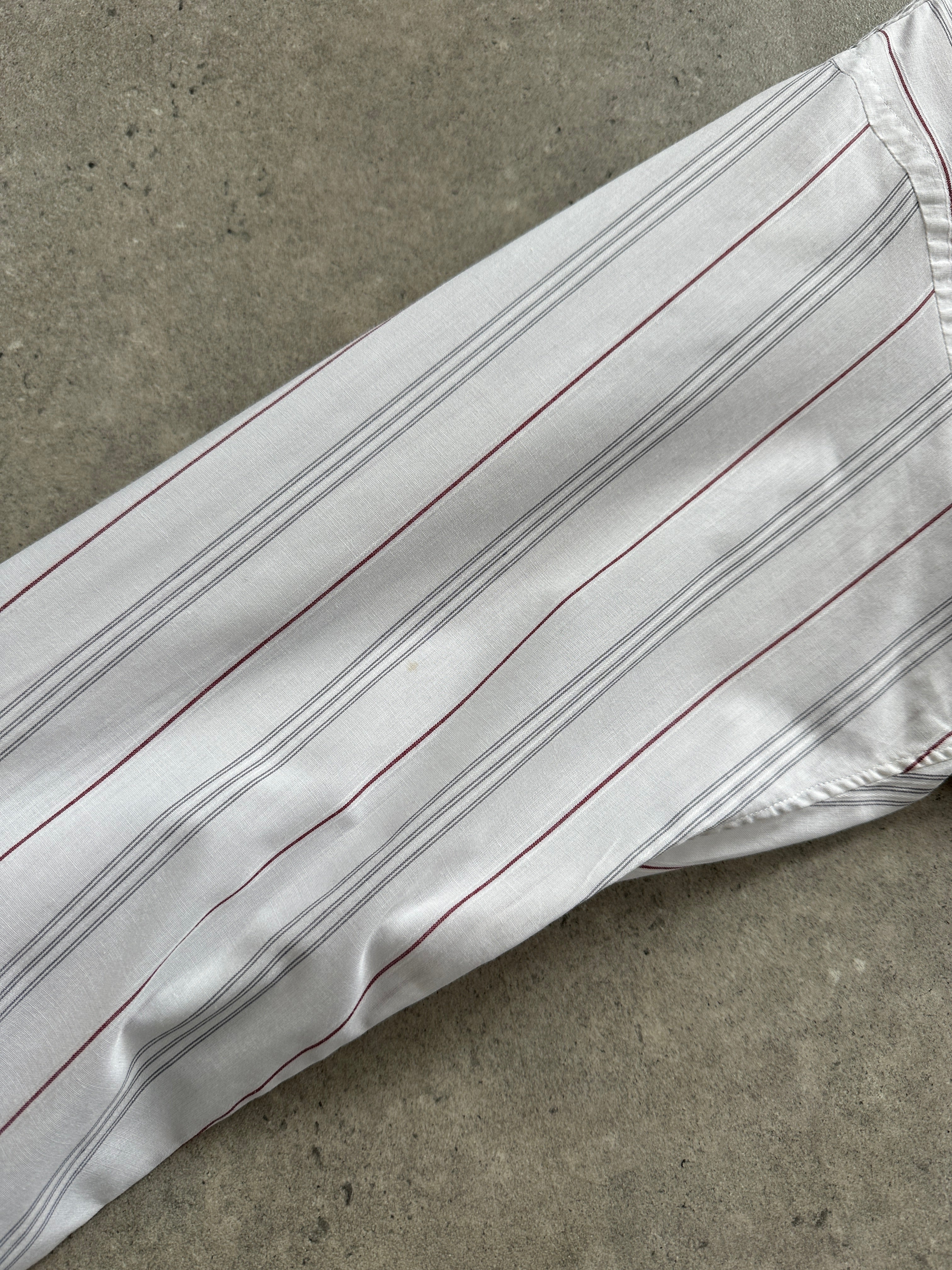 Christian Dior striped cotton logo shirt in size M, featuring a classic design with the Dior brand logo and stylish stripe pattern.