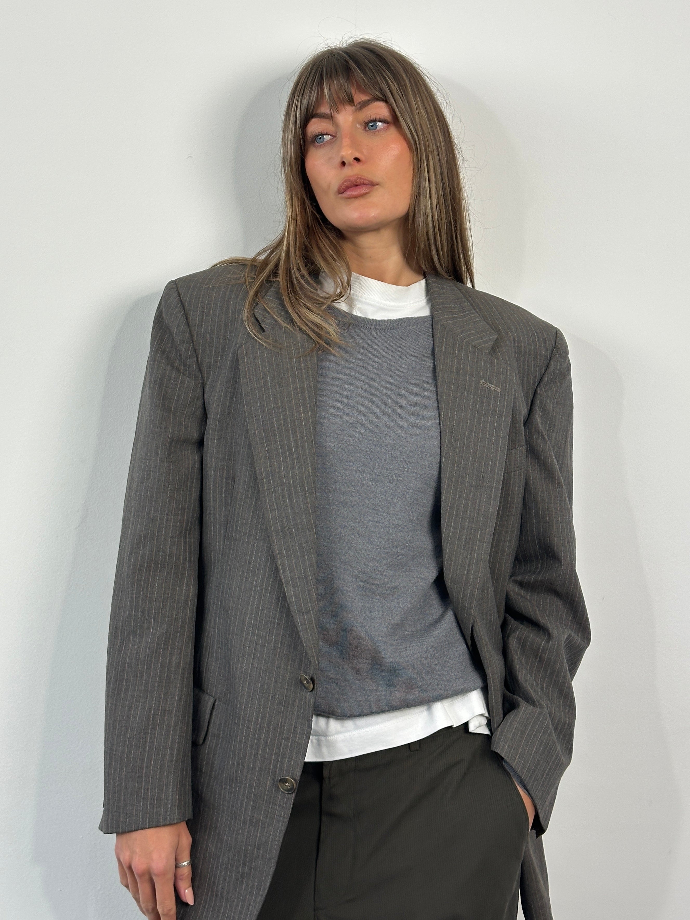 Christian Dior Monsieur 1990s stripe single-breasted blazer in size 40R/L, featuring classic tailored design and bold stripe pattern.