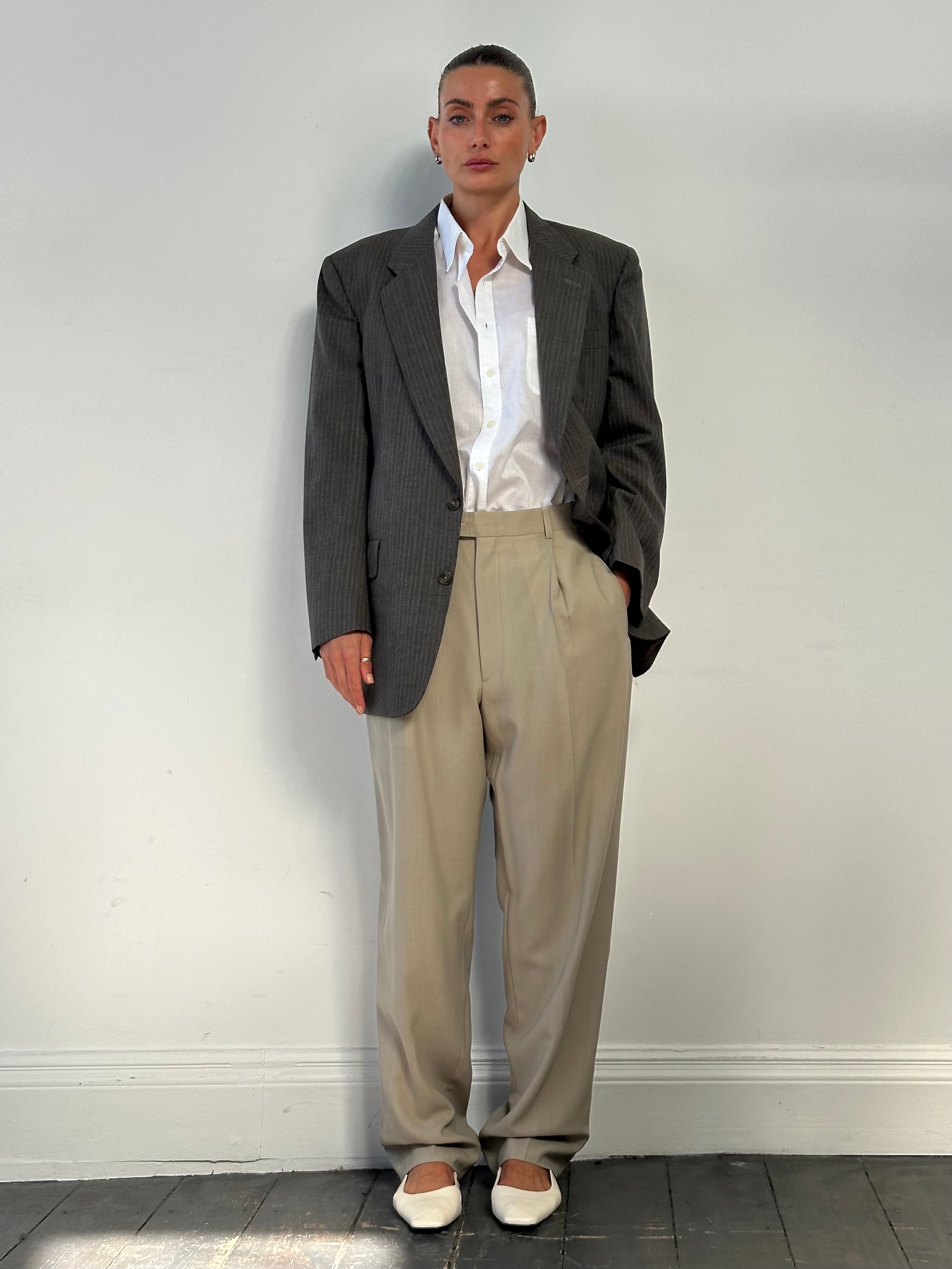 Vintage wool high waisted straight leg trousers in a classic fit, displayed on a neutral background.
