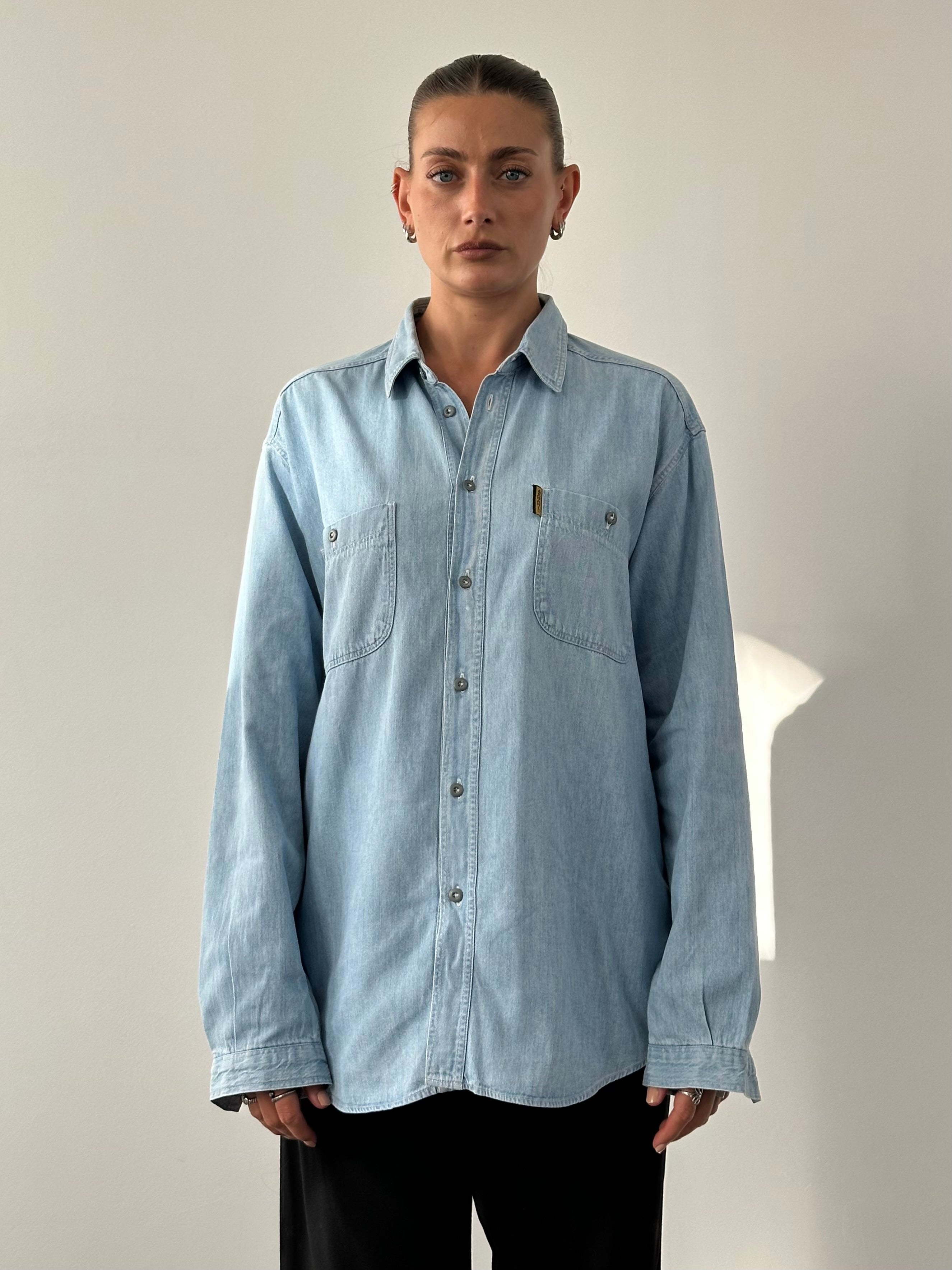 Armani Jeans pure cotton denim shirt in XL with logo detail, featuring a classic button-up design and long sleeves.