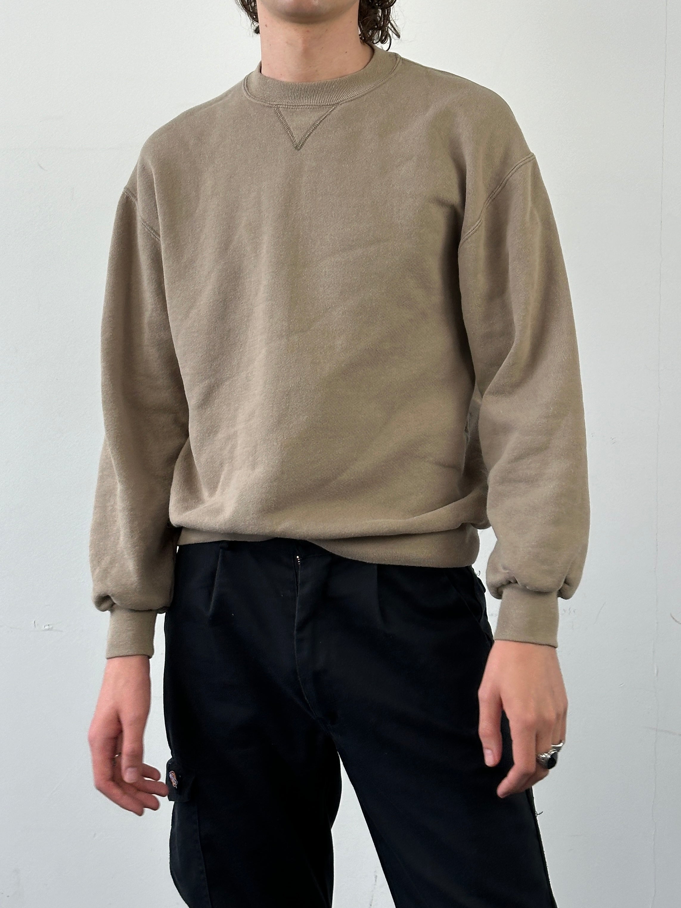 Vintage cotton sweatshirt shirt in M/L size, featuring a classic design and soft fabric, displayed flat on a neutral background.