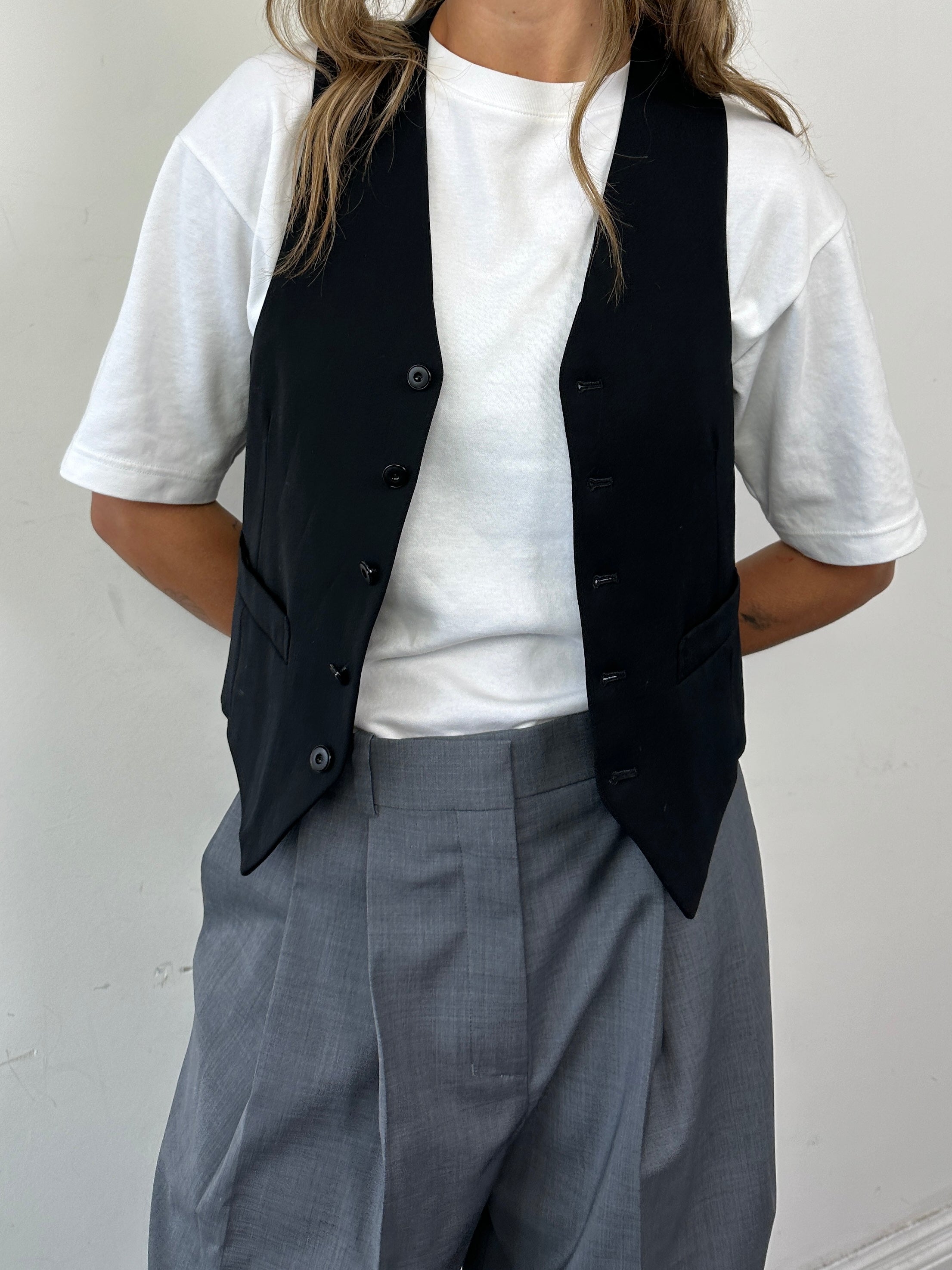 Vintage wool blend tailored waistcoat in size M, featuring classic design and button details.