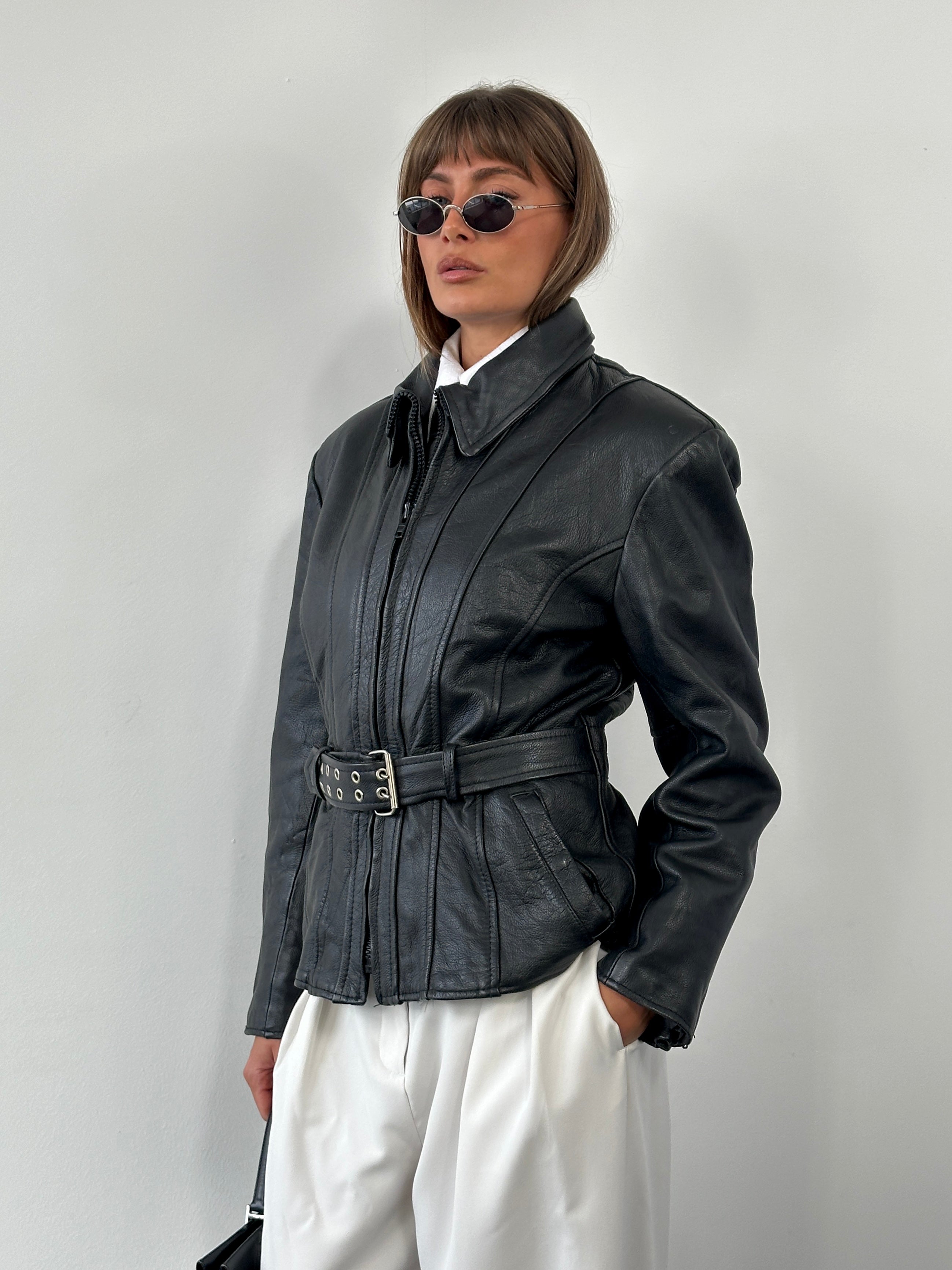Vintage 1990s high neck belted leather jacket in medium size, featuring classic design and authentic leather texture.