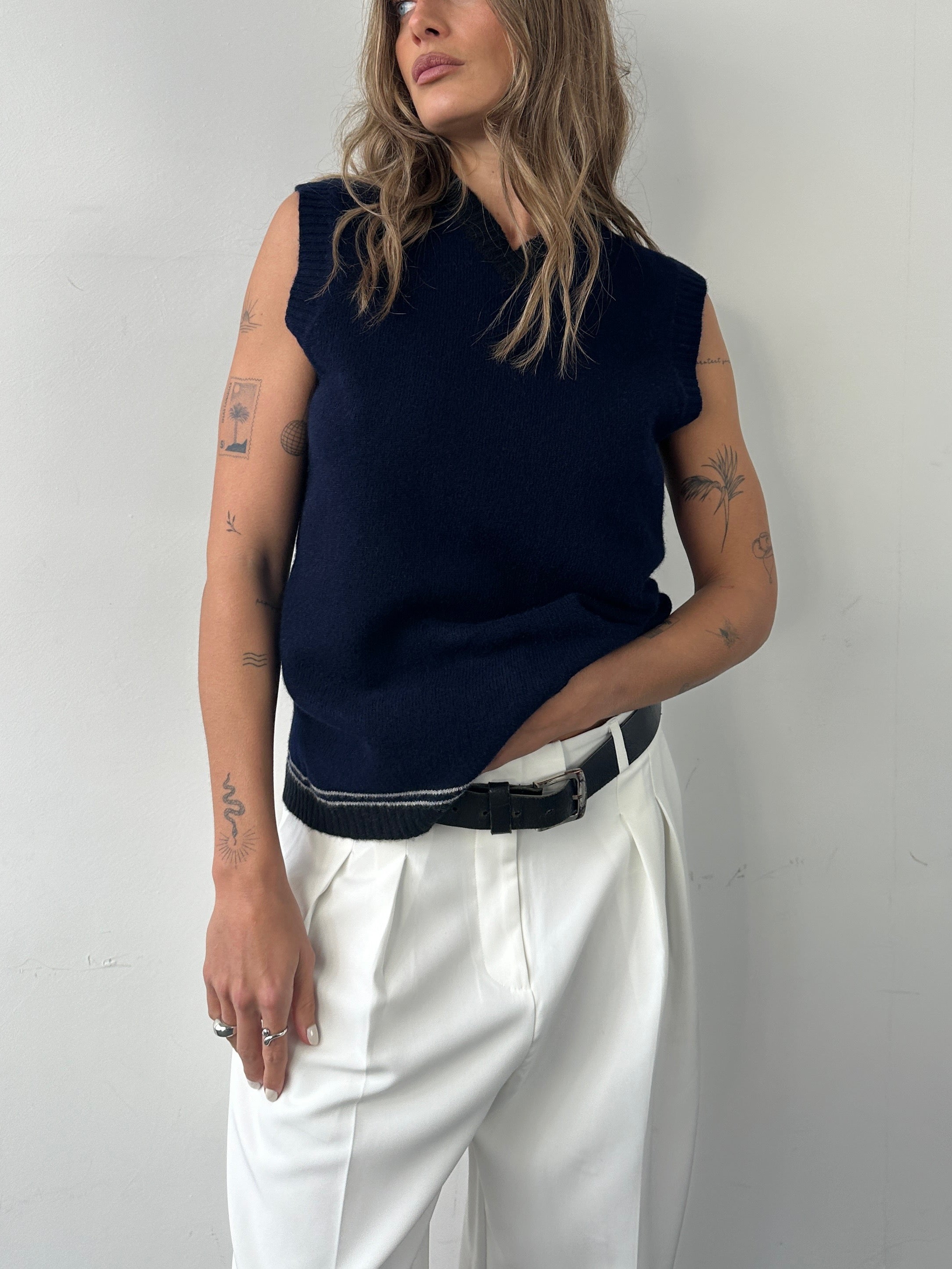 Vintage pure lambswool V-neck sleeveless vest jumper in size M, featuring a classic design and soft, warm fabric.