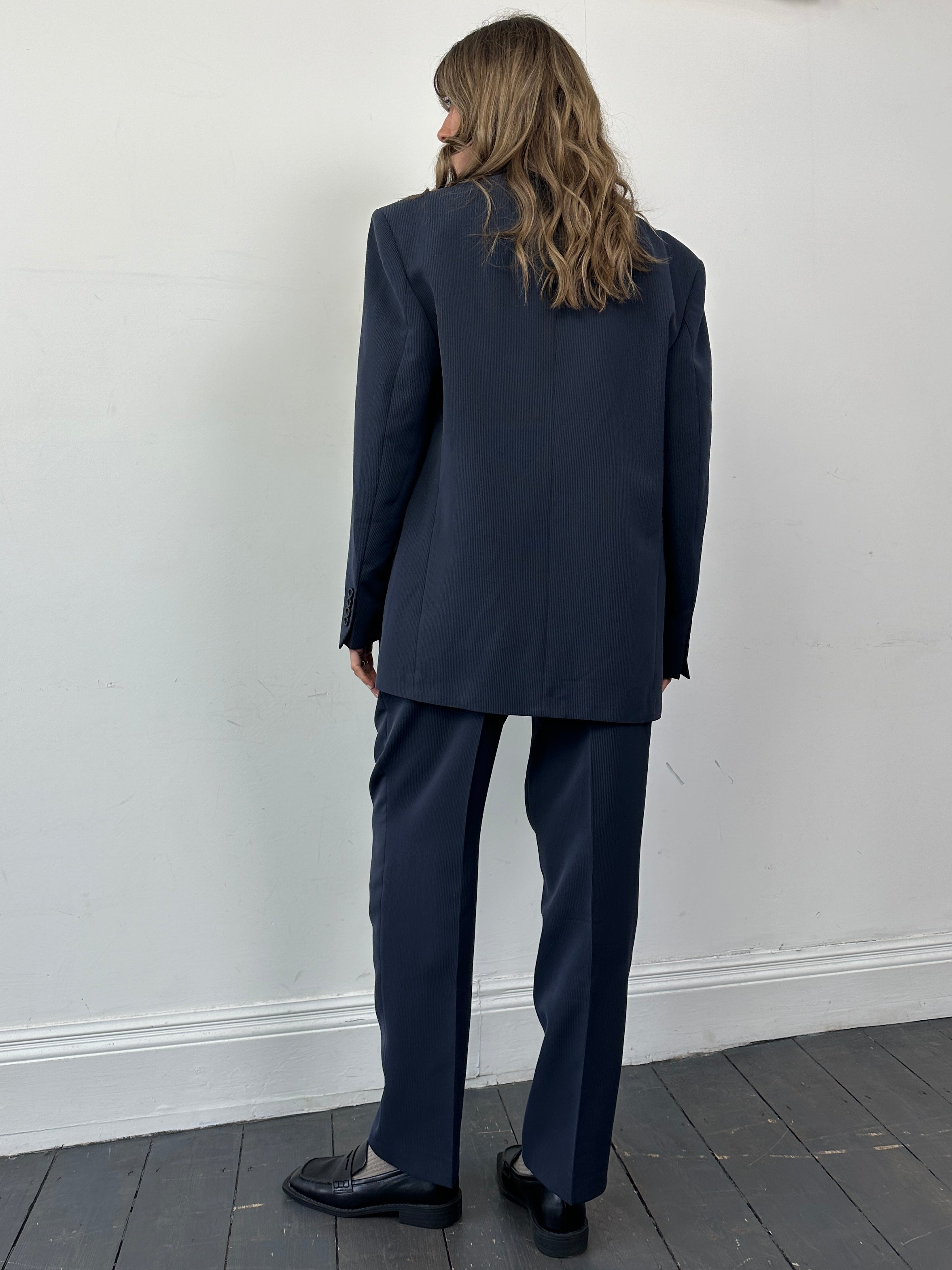 Vintage wool blend three-piece suit in size 40R/W32, featuring a tailored jacket, vest, and matching trousers in classic style.