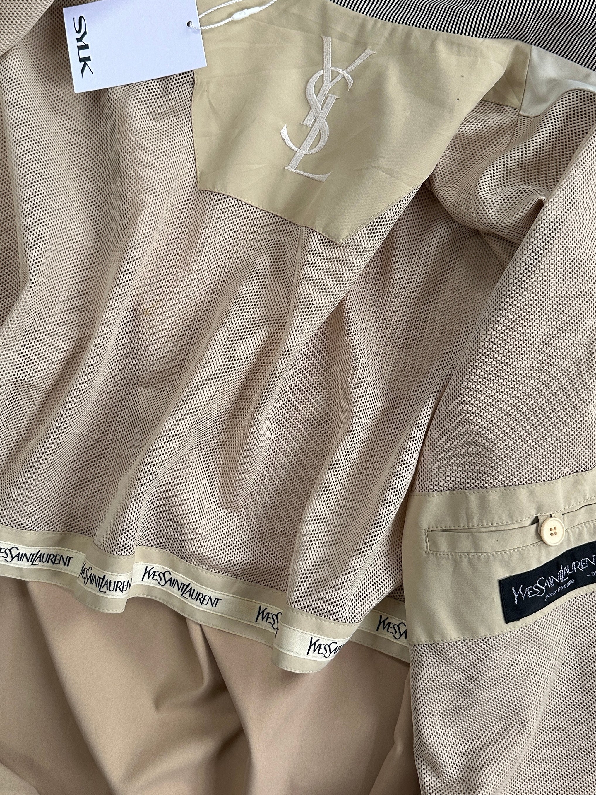 Yves Saint Laurent Pour Homme logo bomber jacket in size L, black with branding details, displayed on a hanger.