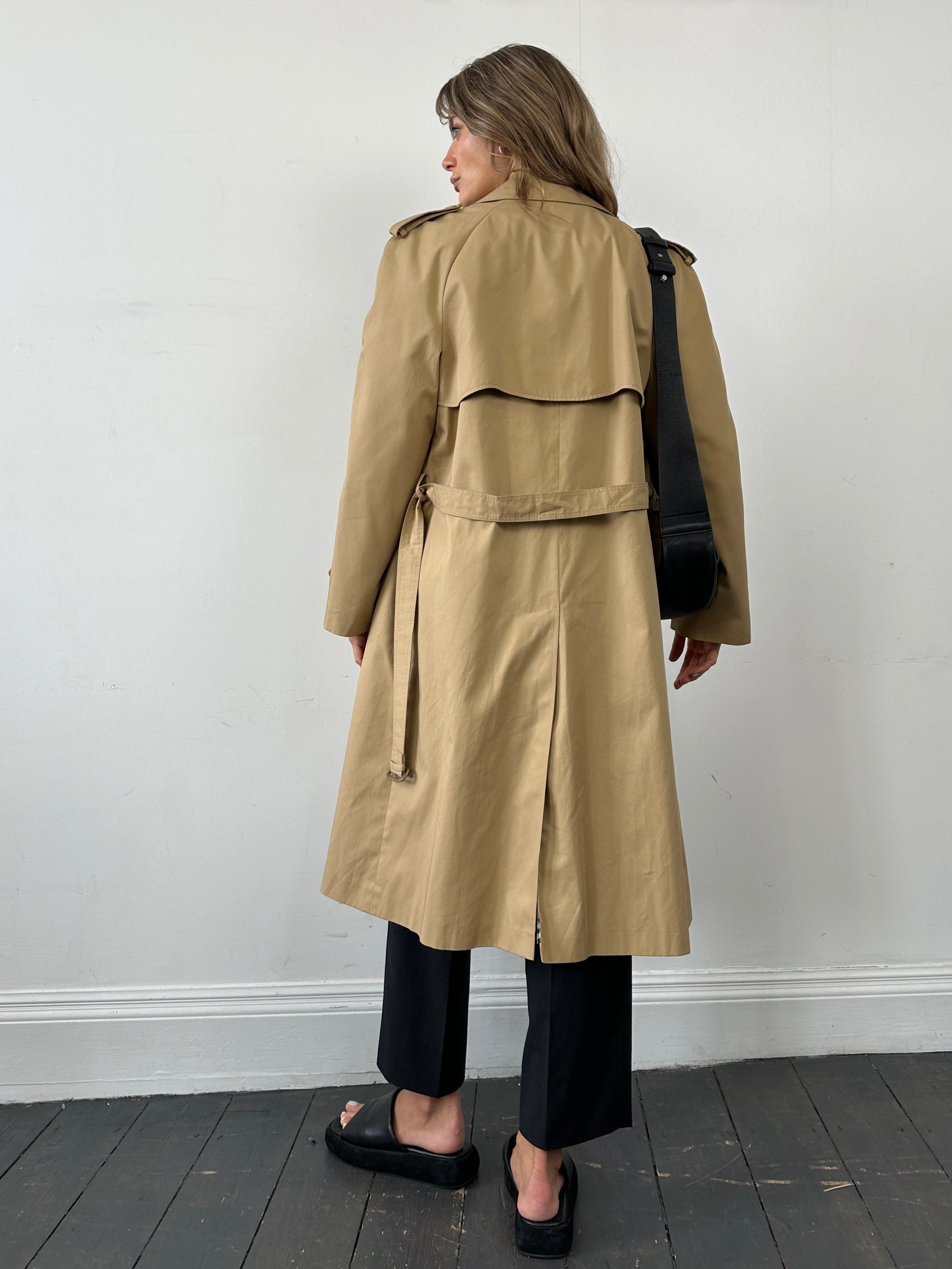 Vintage cotton double-breasted belted trench coat in size L, featuring classic design and timeless style.