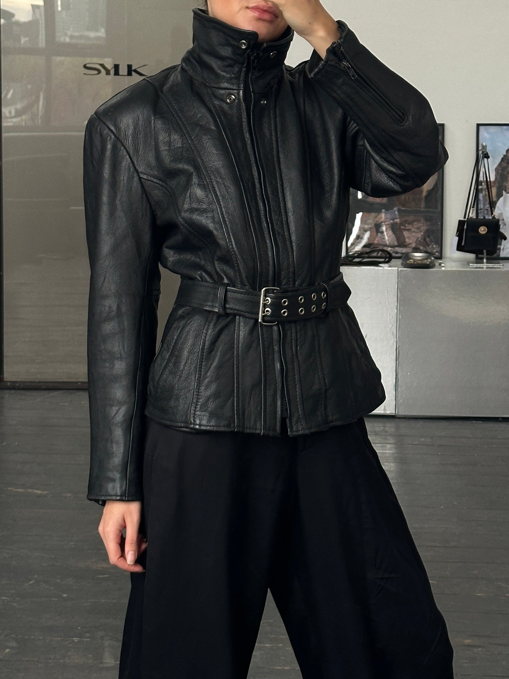 Vintage 1990s high neck belted leather jacket, medium size, featuring classic leather texture and stylish design.