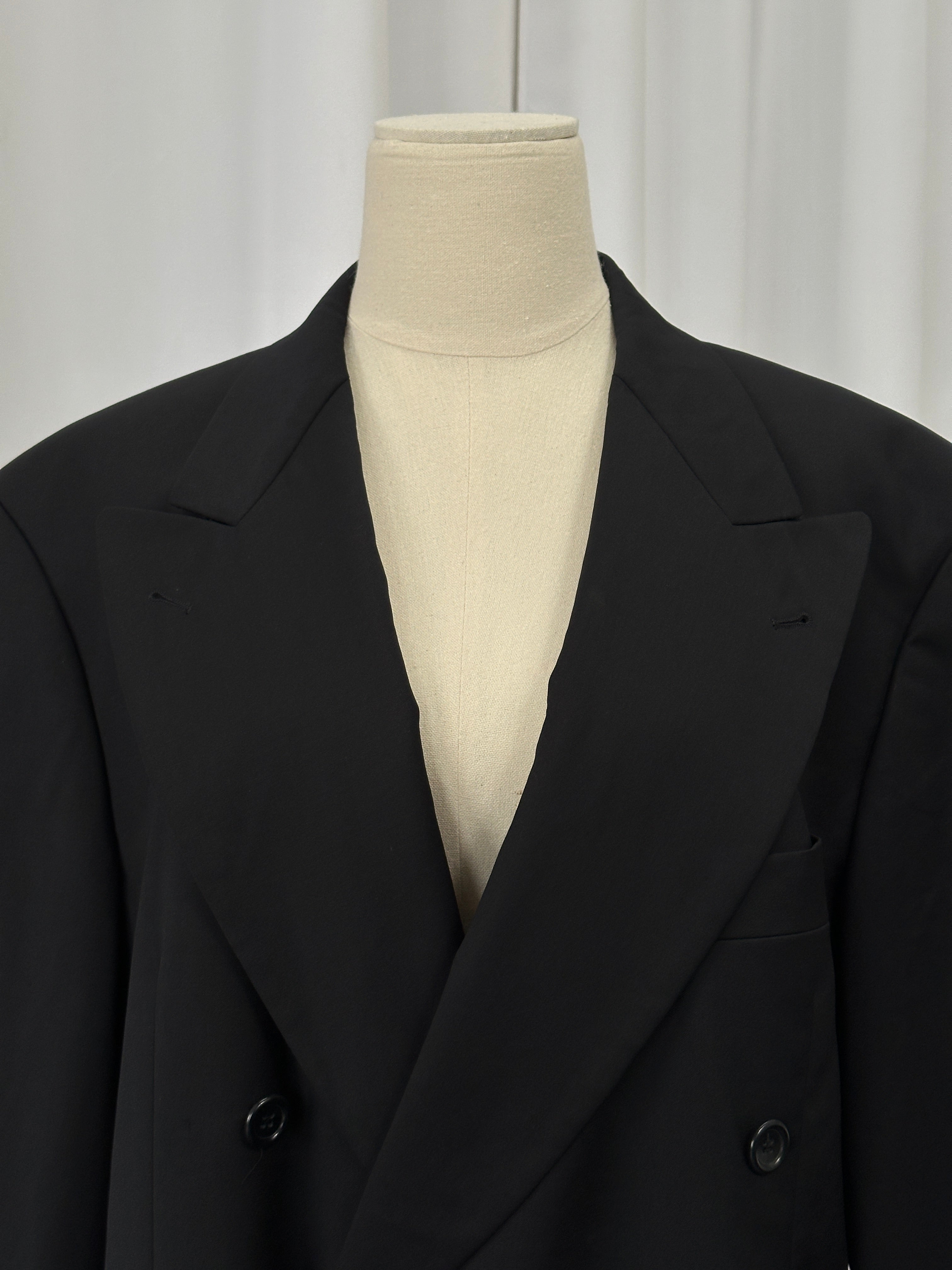 Hugo Boss x Loro Piana pure wool double-breasted blazer in size 40R/XL, displayed on a hanger, showing its tailored fit and classic design.