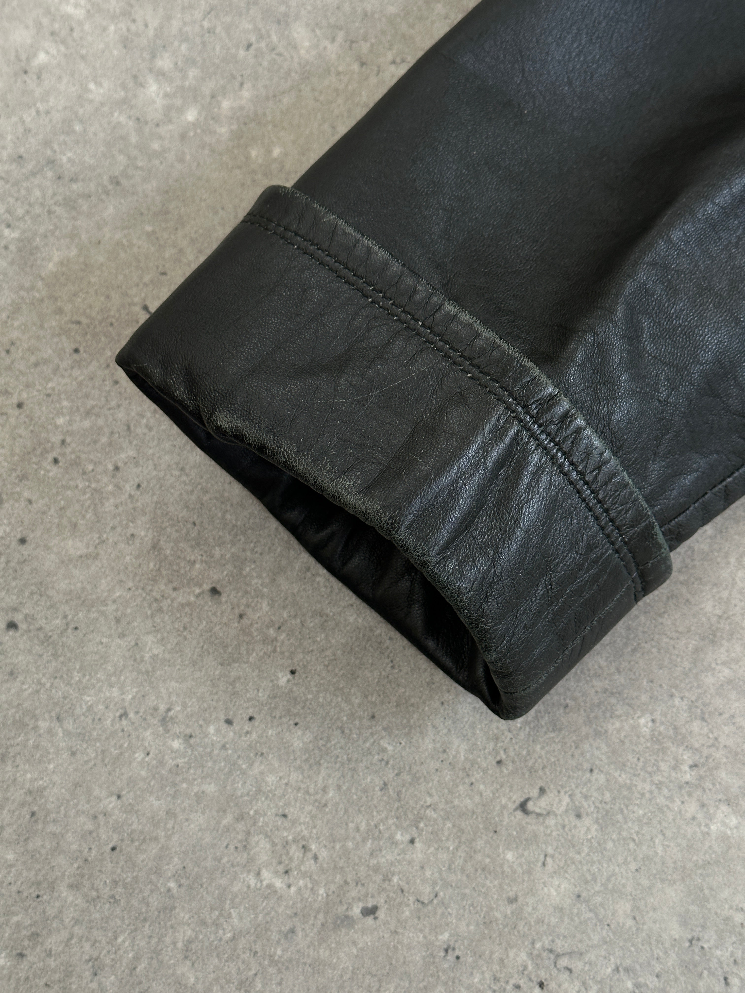 Vintage 1990s floor-length leather trench coat, size large, featuring classic design and rich leather texture.