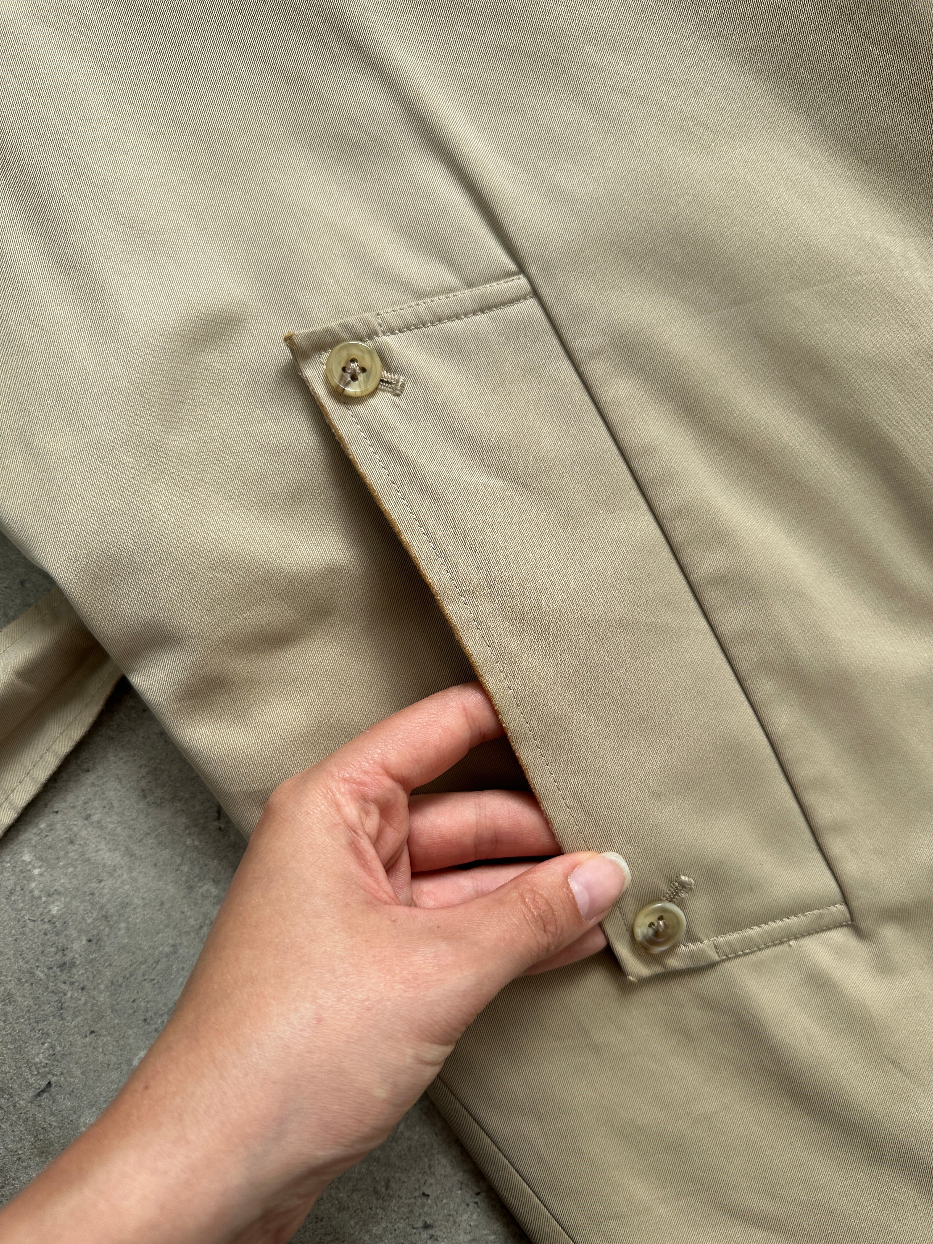Aquascutum pure cotton belted trench coat with concealed placket, classic beige color, long sleeves, and button details.