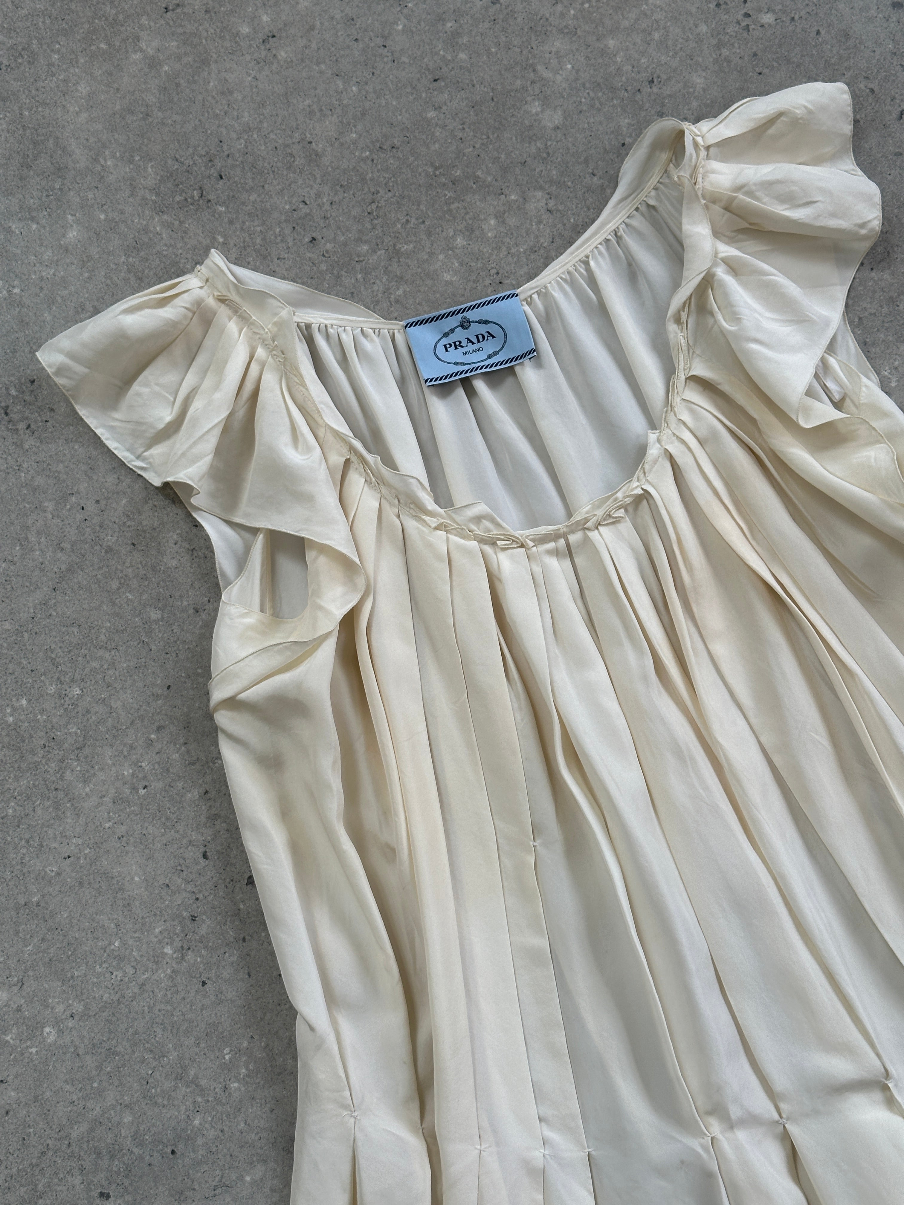 Prada 2012 pure silk pleated slip dress in size L, featuring a sleek, flowing design with elegant pleats and a smooth silk fabric.