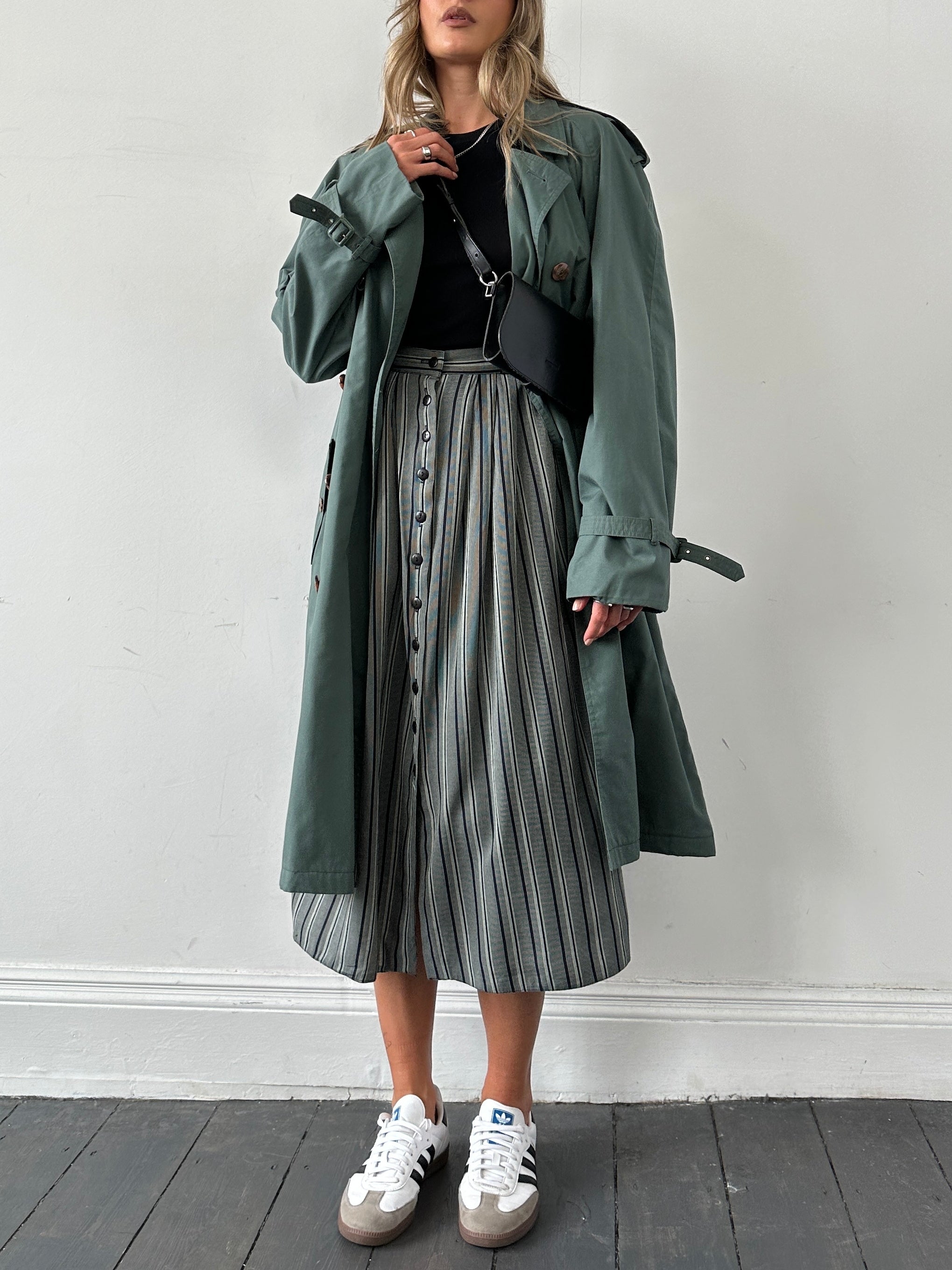 Vintage British vintage stripe maxi skirt in size W26, featuring bold horizontal stripes and flowing fabric.