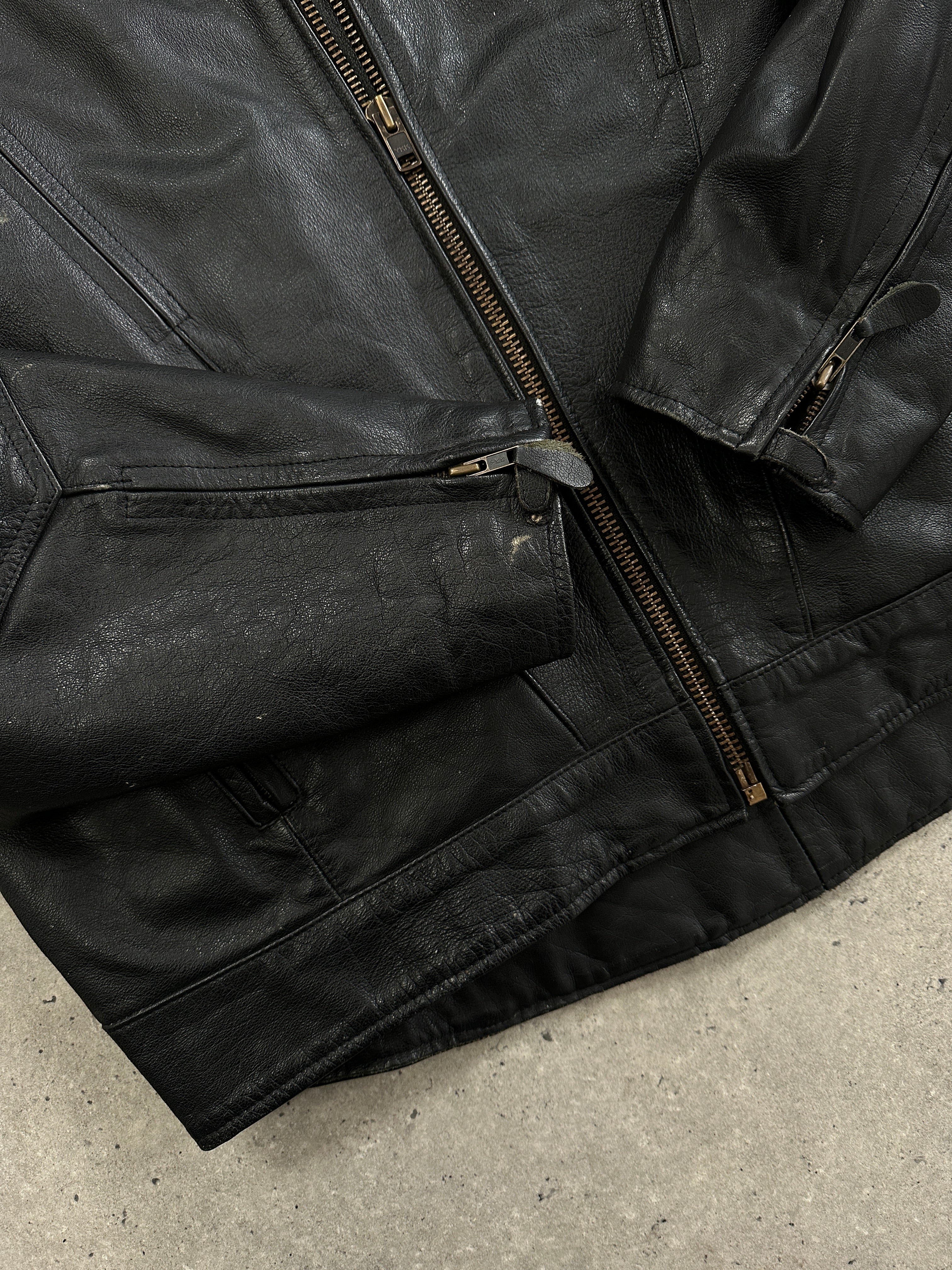 Vintage leather motorcycle jacket in XL size with classic design, featuring sturdy stitching and a rugged, stylish look.