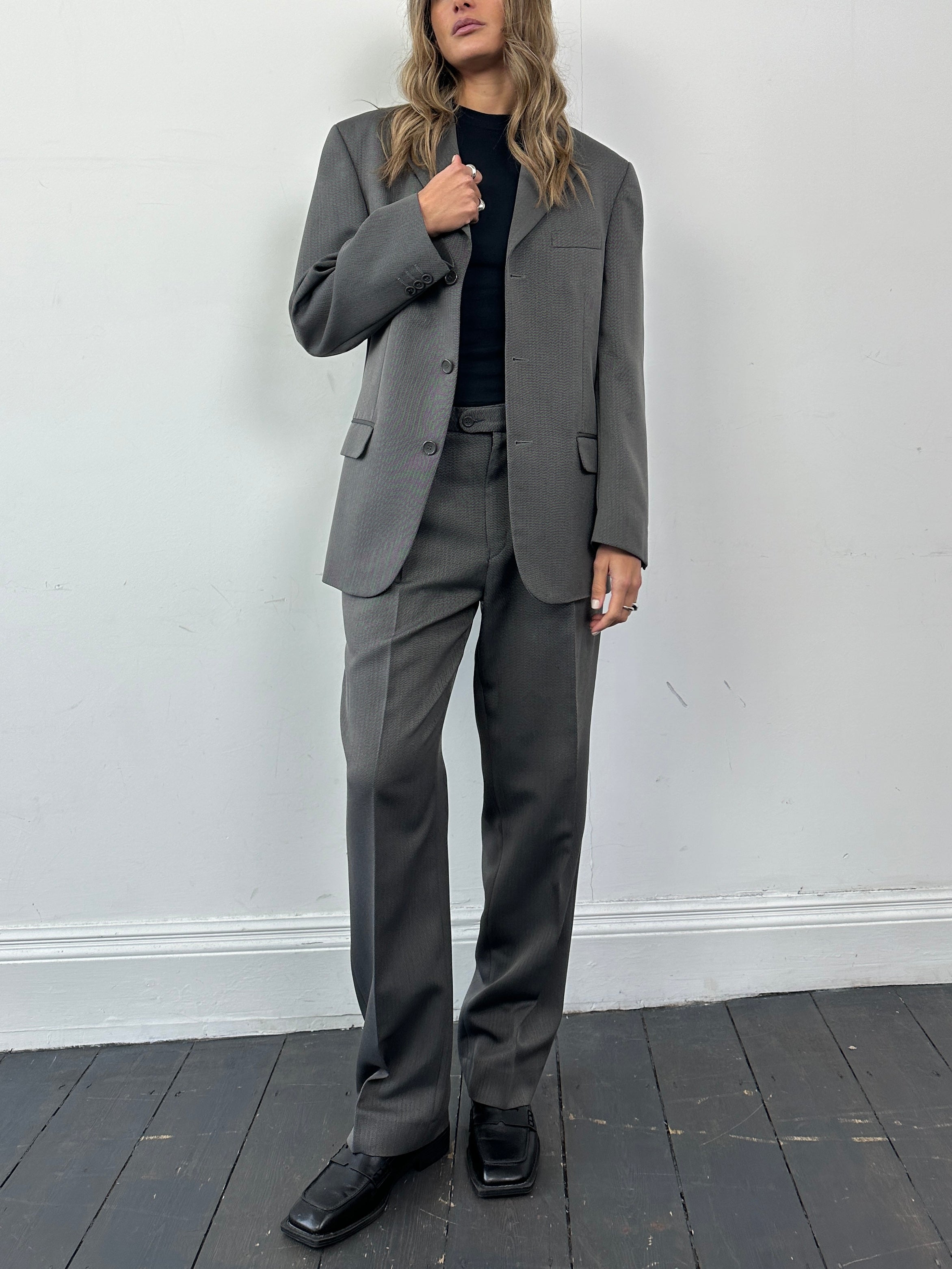Vintage vintage herringbone single-breasted jumpsuit in size 38R/W32, featuring classic tailored design and textured fabric.