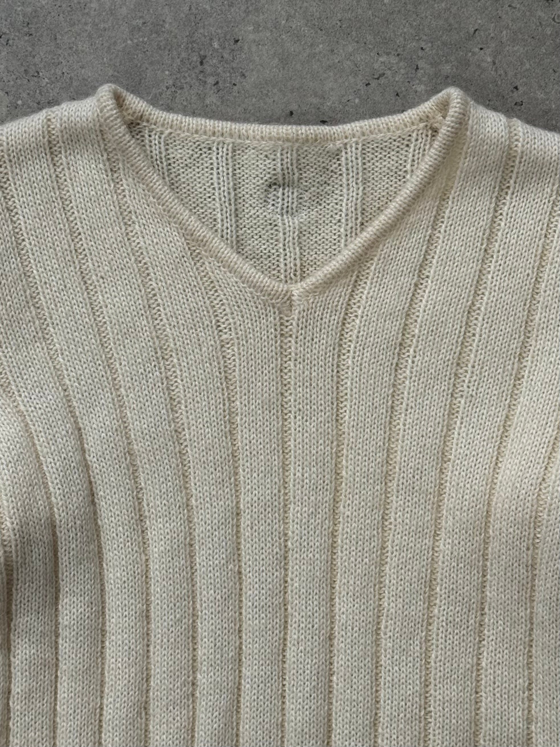 Valentino 1990s wool and mohair V-neck knitted jumper in cream, showcasing its soft texture and classic fit.