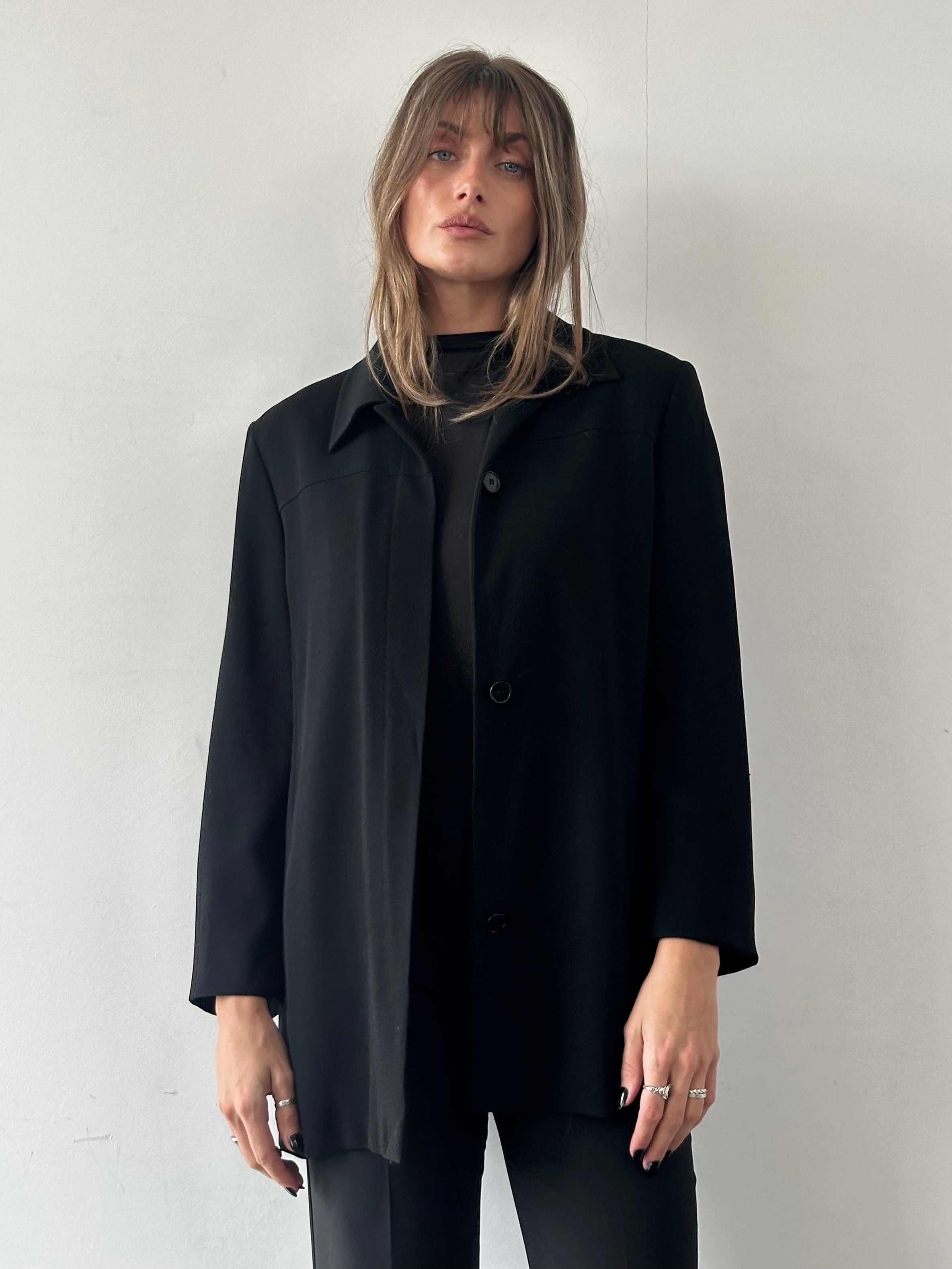Max Mara minimalist blazer with concealed placket, tailored fit, in classic neutral fabric, shown on a hanger.