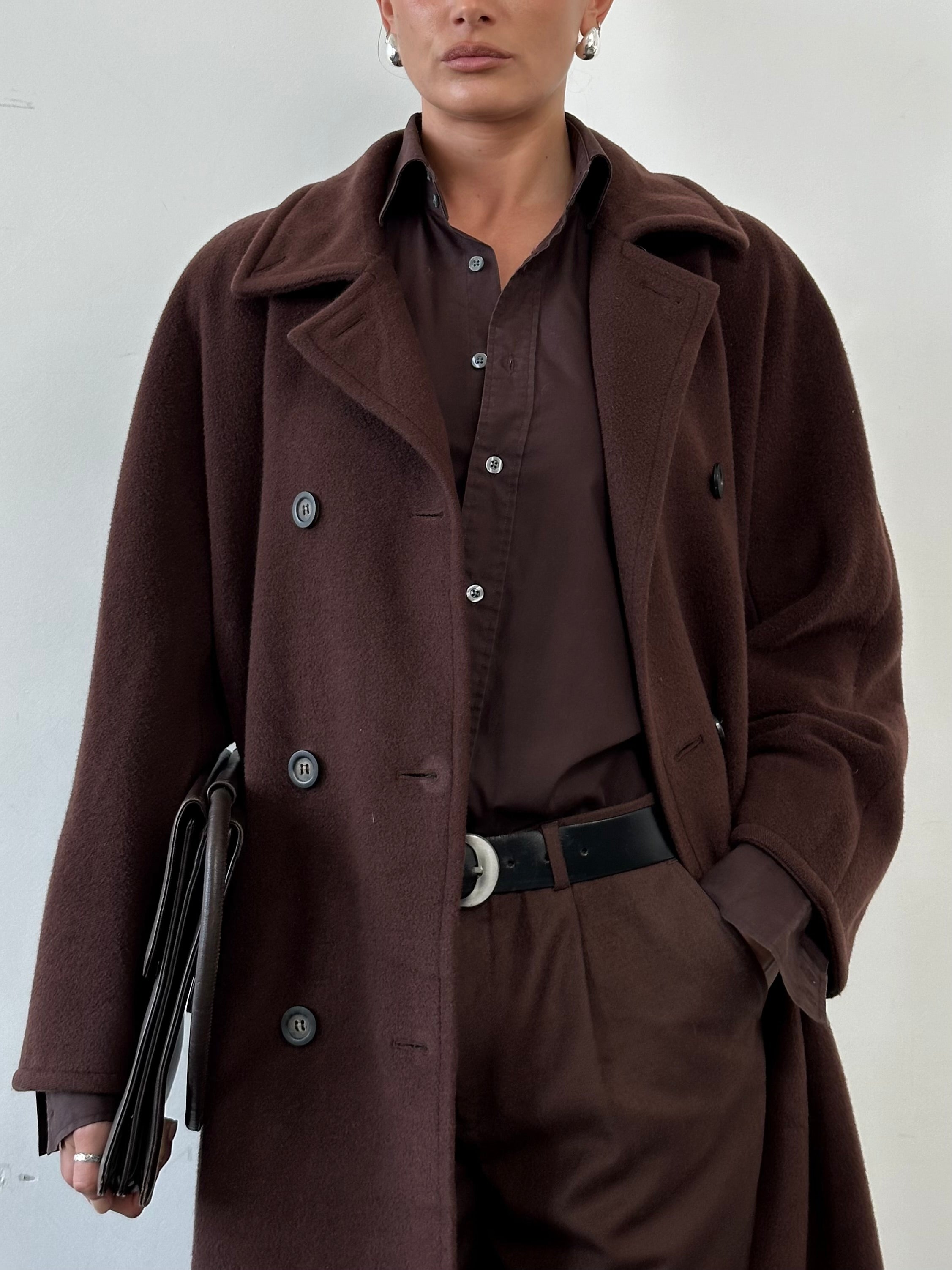 Marella wool cashmere double-breasted coat in size L, beige color, tailored with lapels and buttons, displayed hanging on a hanger.