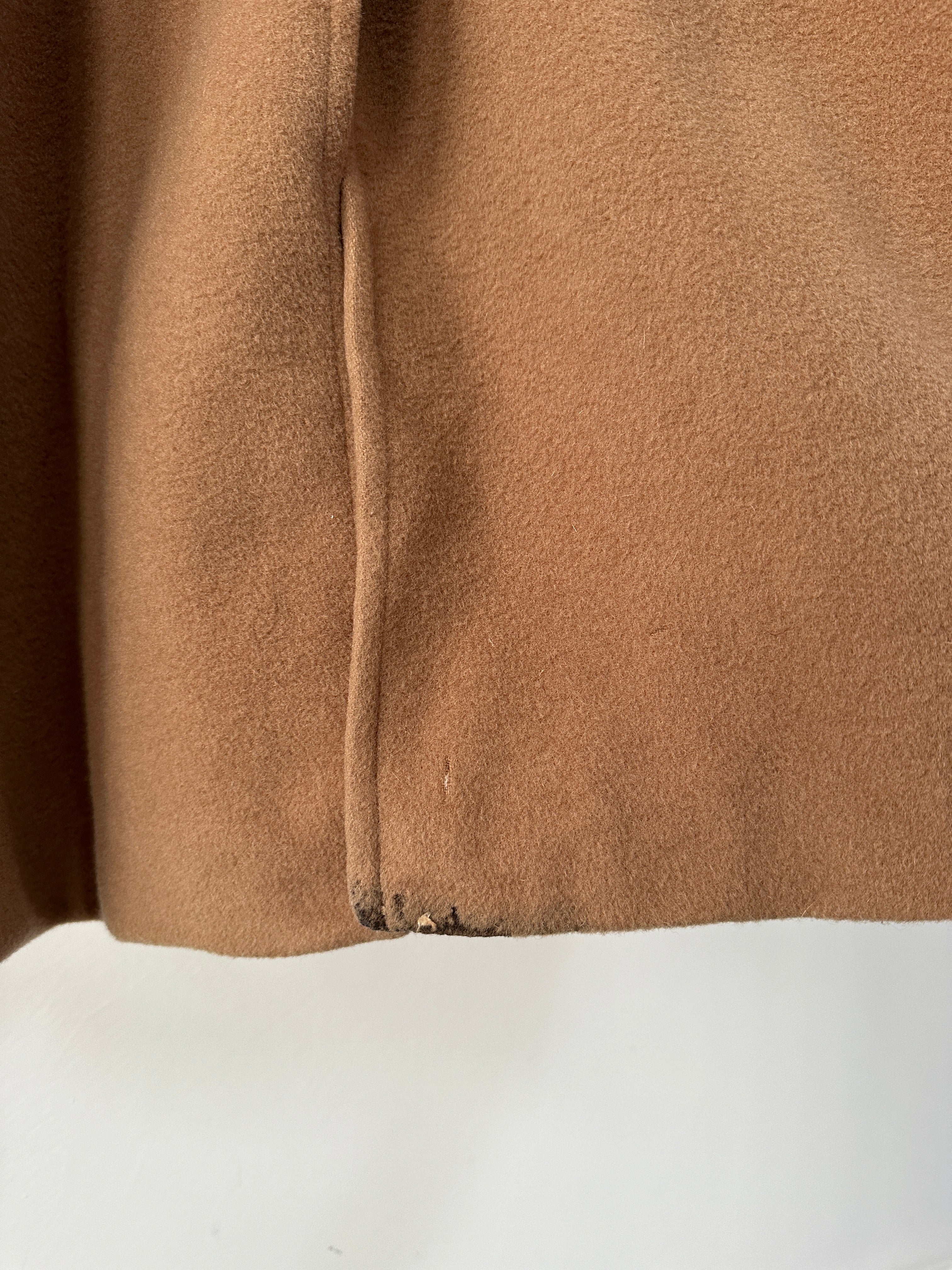 Burberry wool camel hair single-breasted coat in size L displayed on a hanger with classic design and tailored fit.