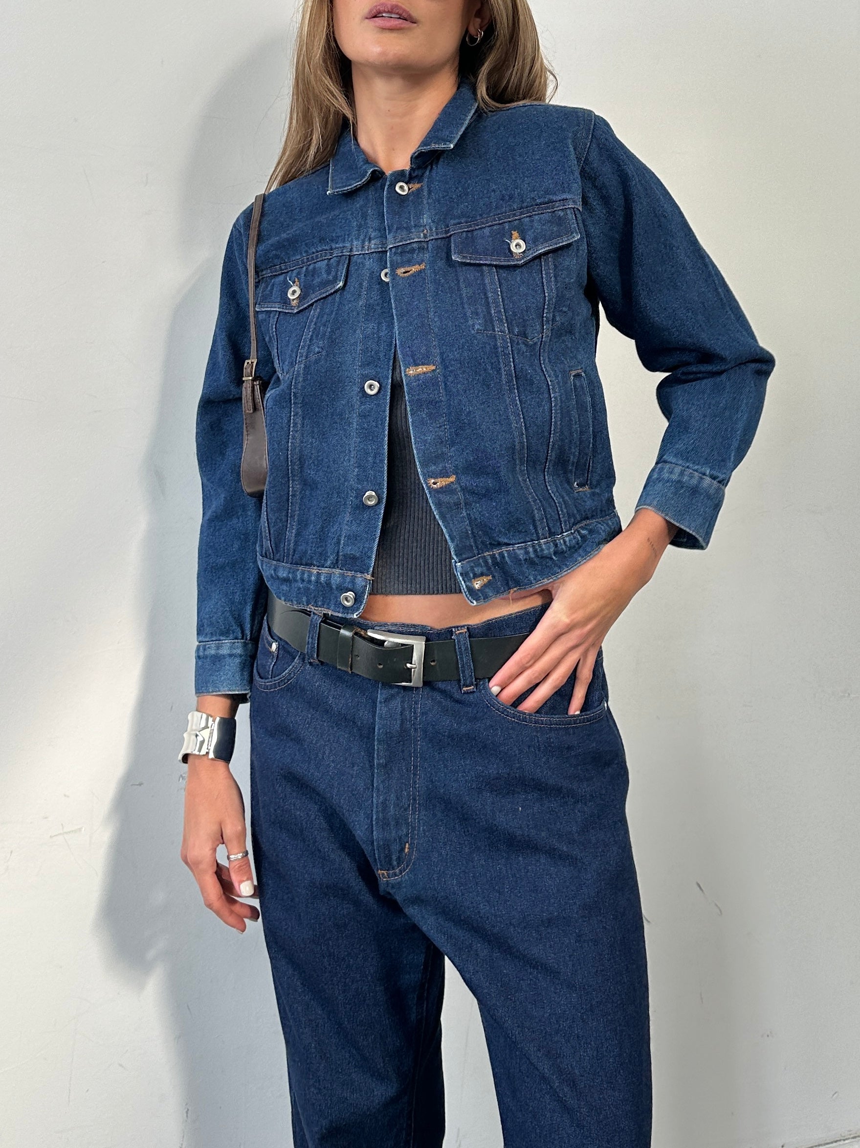 Vintage brand vintage button-up indigo denim jacket in size XS/S, showing classic collar, front buttons, and chest pockets.