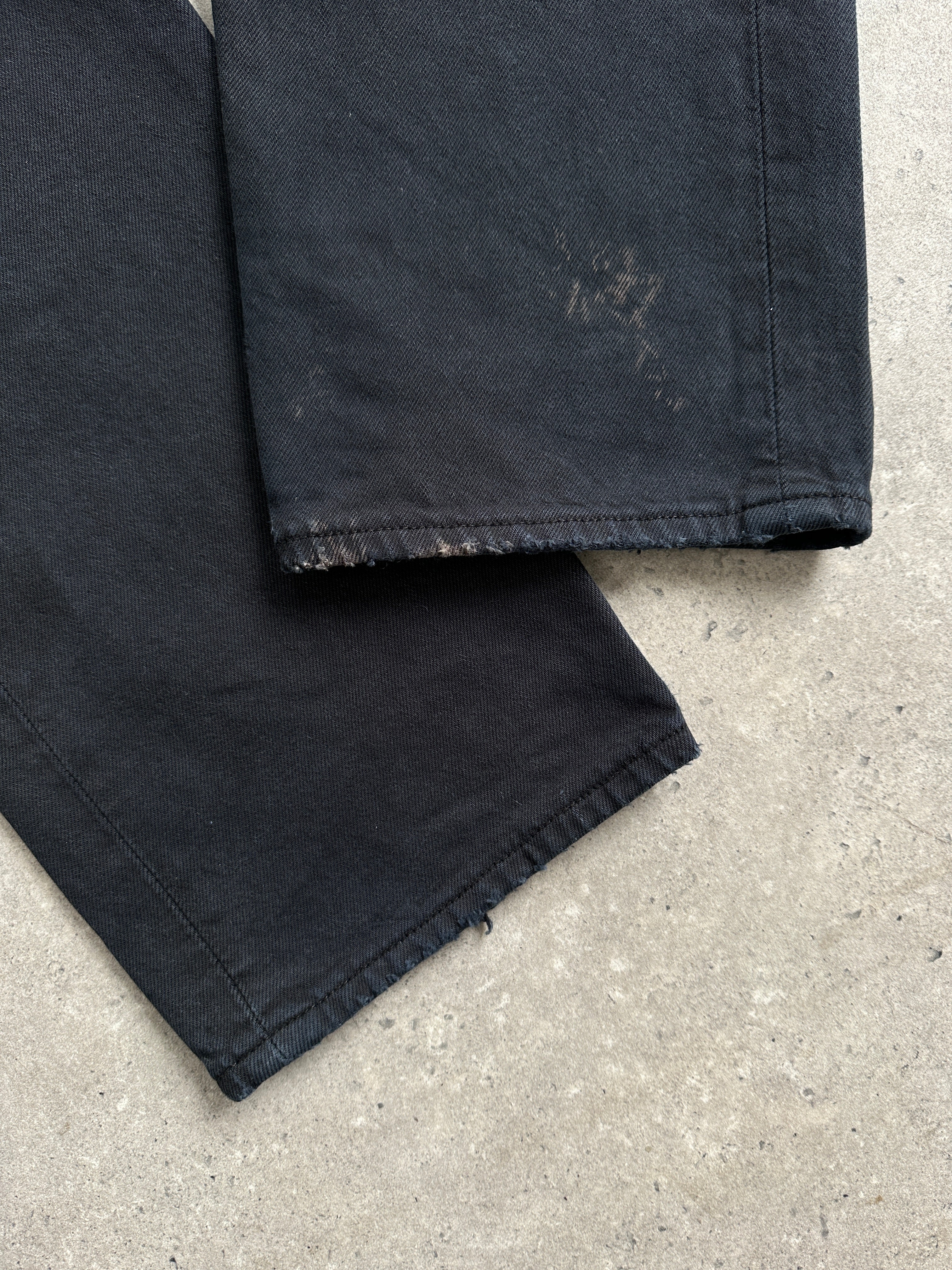 Levi’s 501 straight leg high-waisted denim jeans in W32, showcasing classic blue color and fit with front pockets and belt loops.