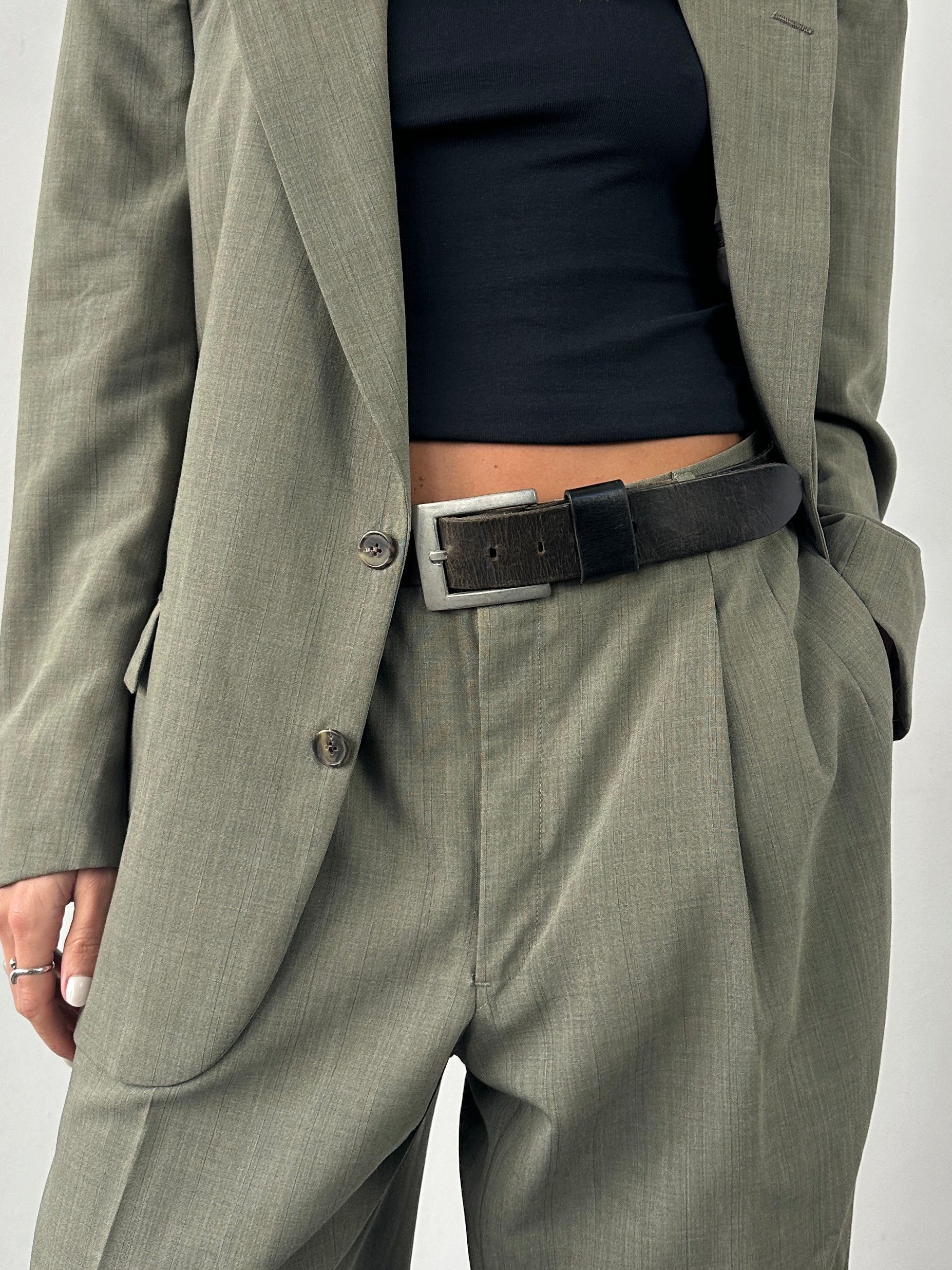 Vintage distressed leather belt in W34-37, featuring a rugged design and metal buckle, perfect for casual or vintage-inspired outfits.