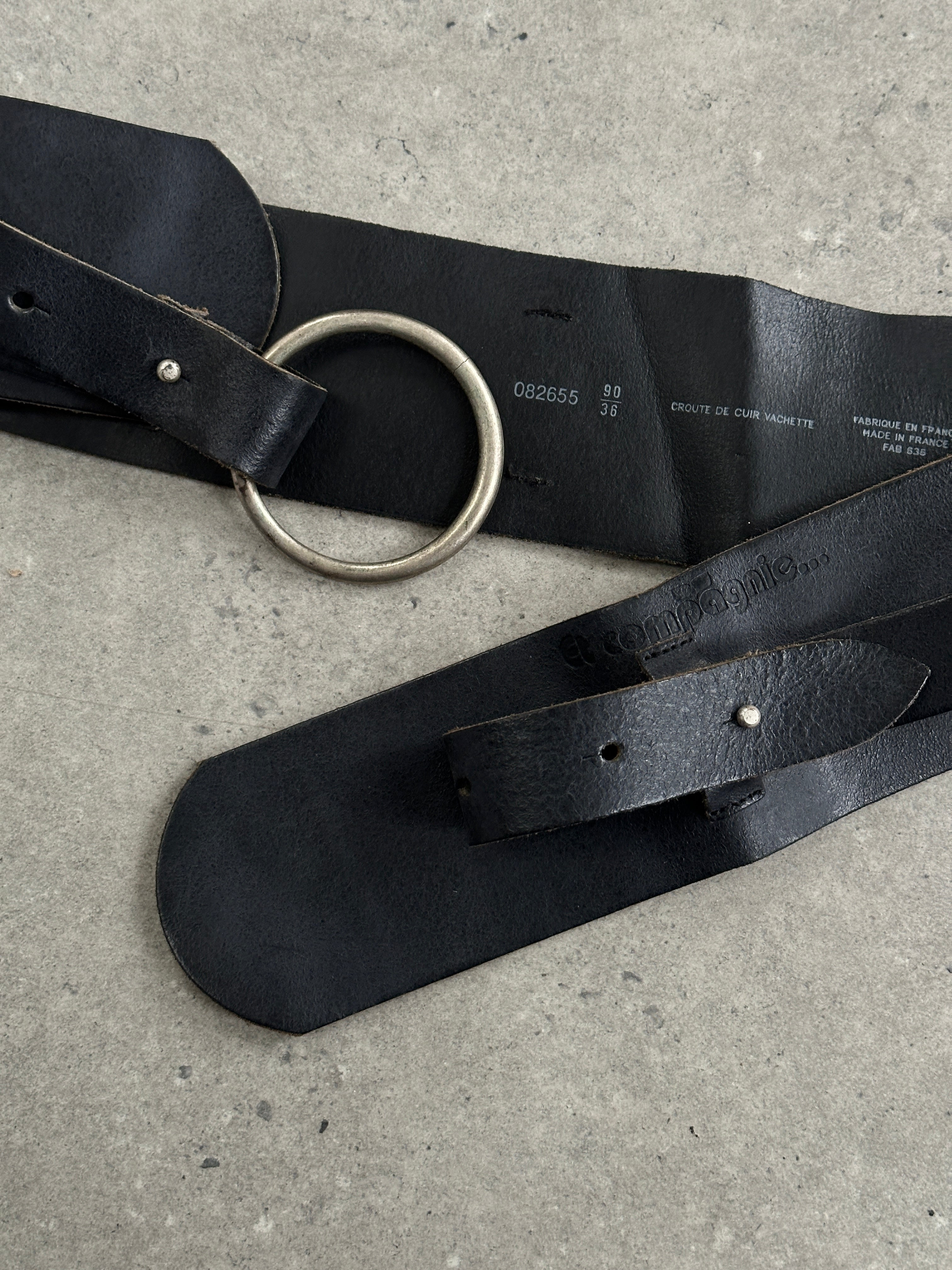 Vintage 1990s French chunky studded leather belt with wide W32-36 size, featuring bold metal studs and classic design.