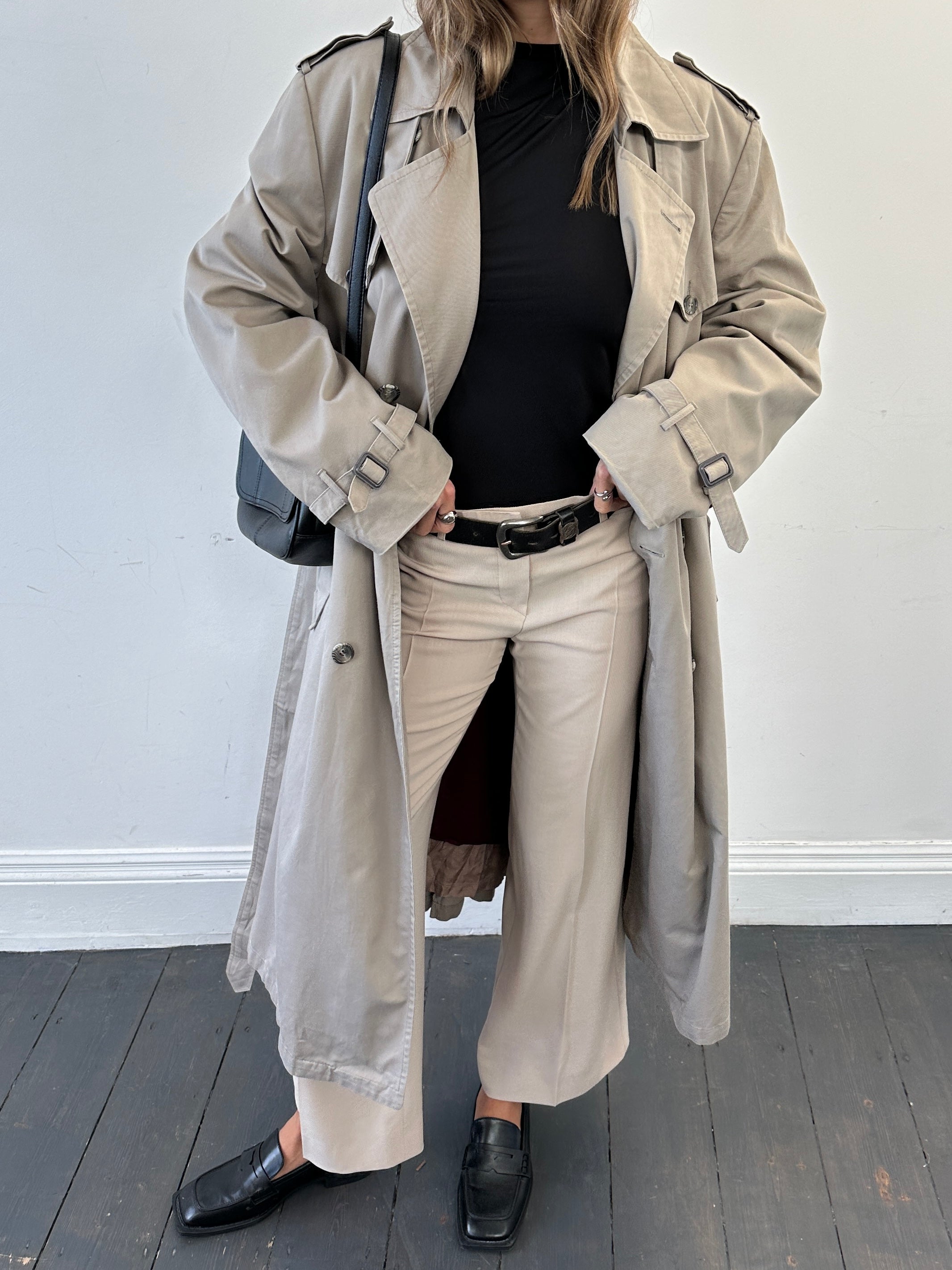 Christian Dior double-breasted cotton trench coat in size L/XL, featuring classic design and stylish button details.