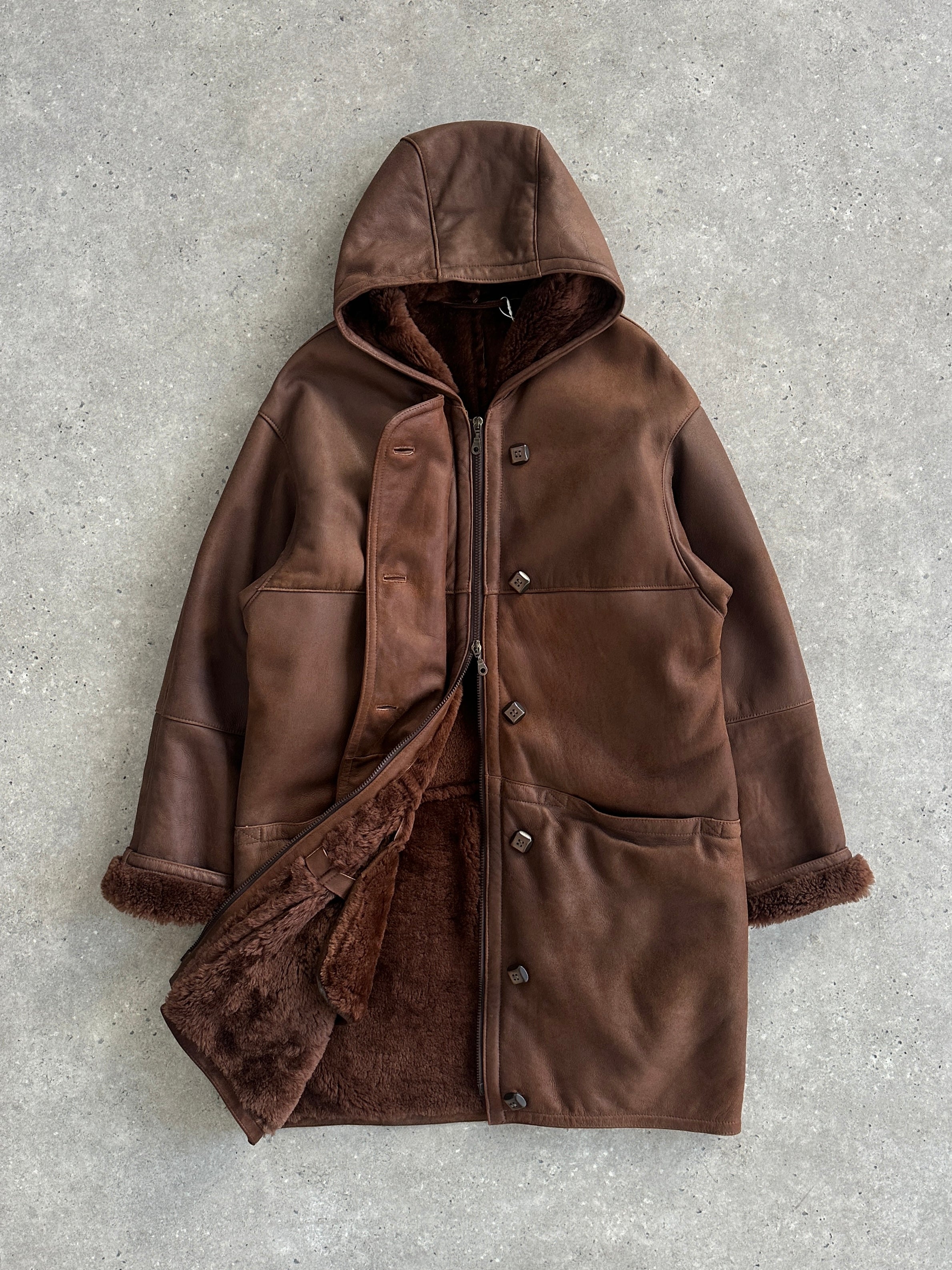 Vintage leather fleece-lined hooded jacket in XL, showcasing its rugged exterior and cozy interior for casual winter wear.