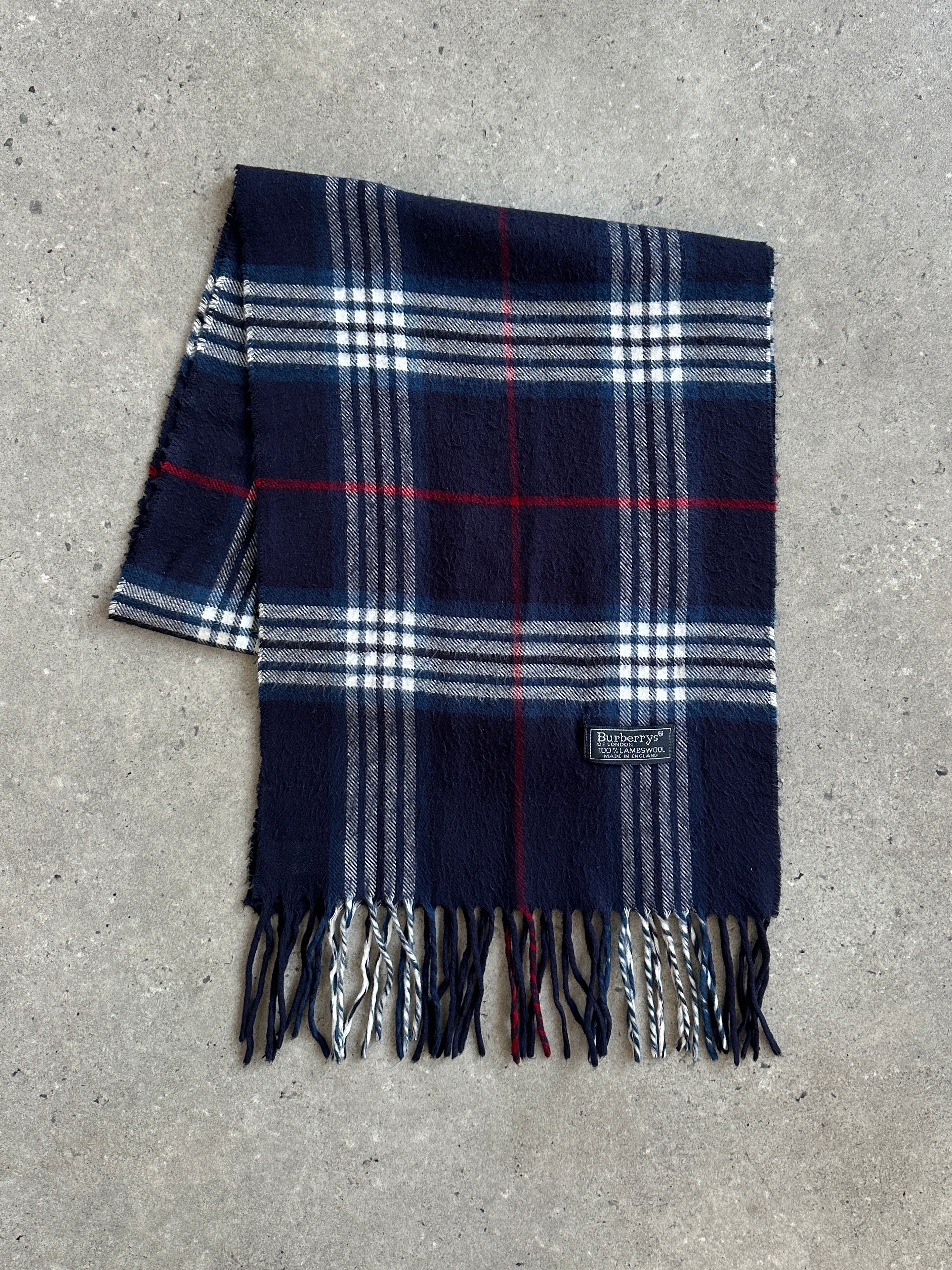 Burberry 1990s pure lambswool check scarf with classic plaid pattern, soft texture, and fringed edges.