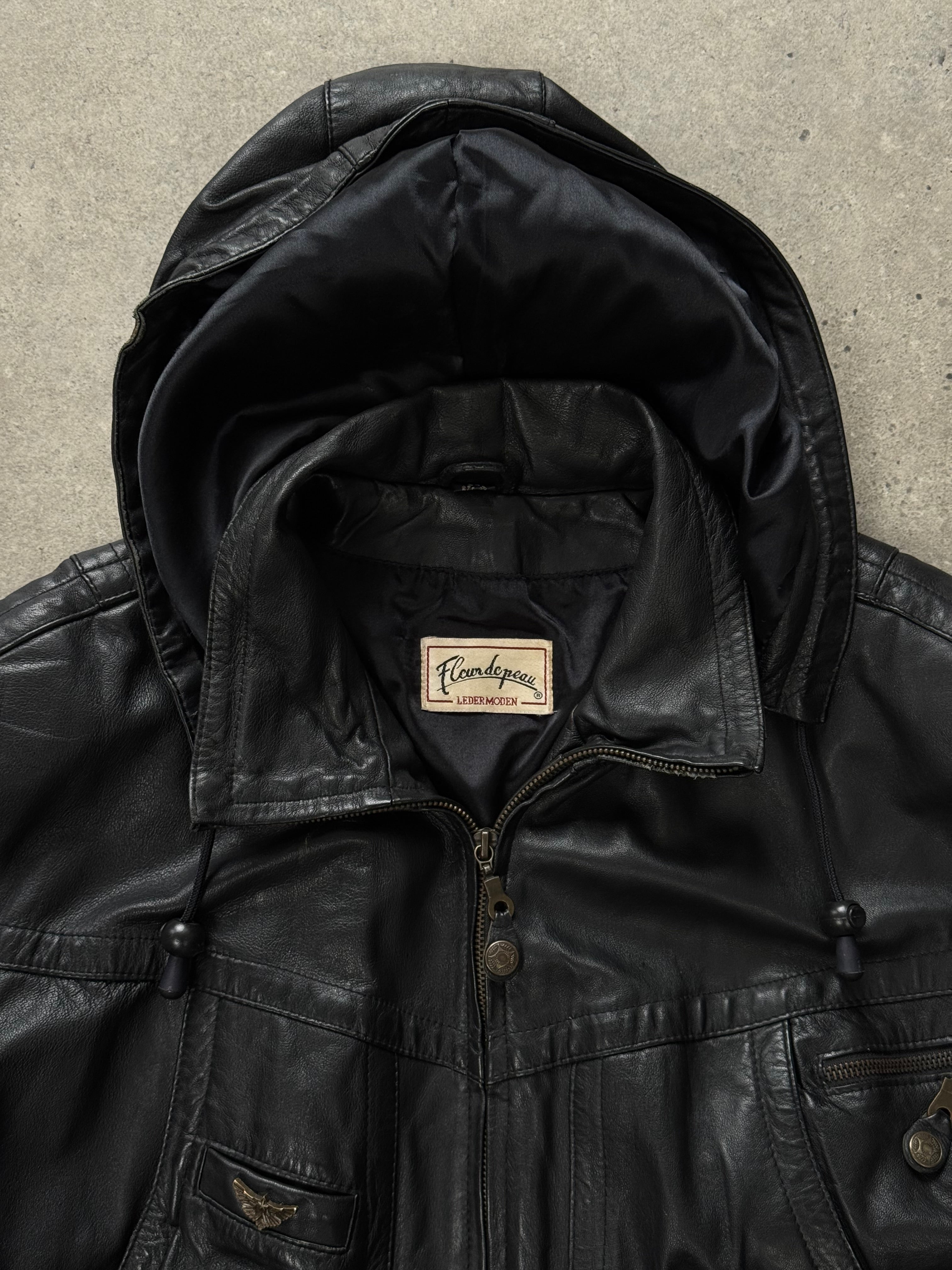 Vintage 1990s leather funnel neck hooded bomber jacket, size small, featuring a classic brown leather design and front zipper closure.