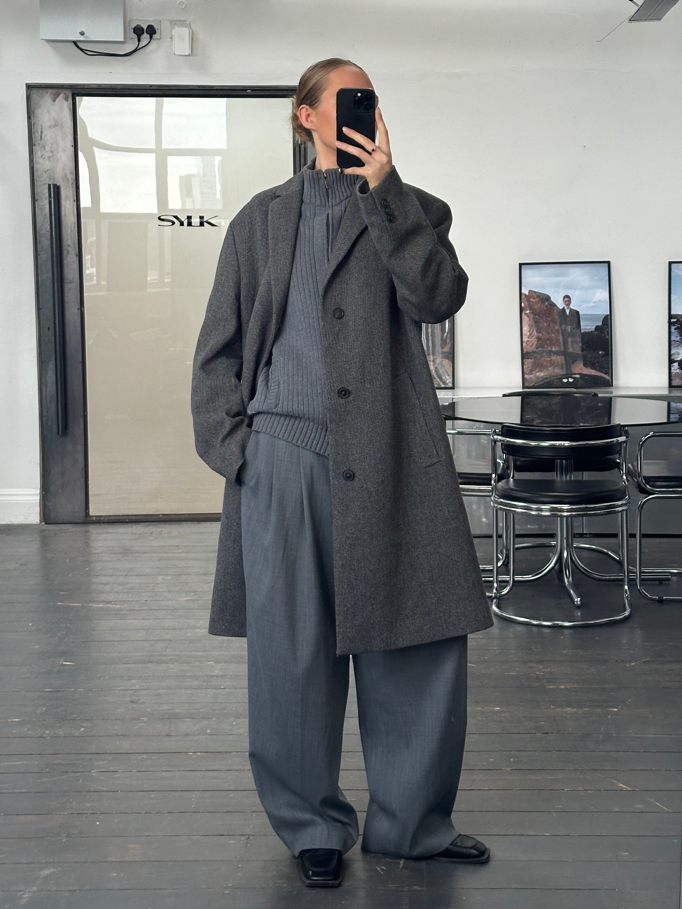 Hugo Boss 1990s wool single-breasted coat in XXL, classic design with a tailored fit and button closure, shown in a neutral color.