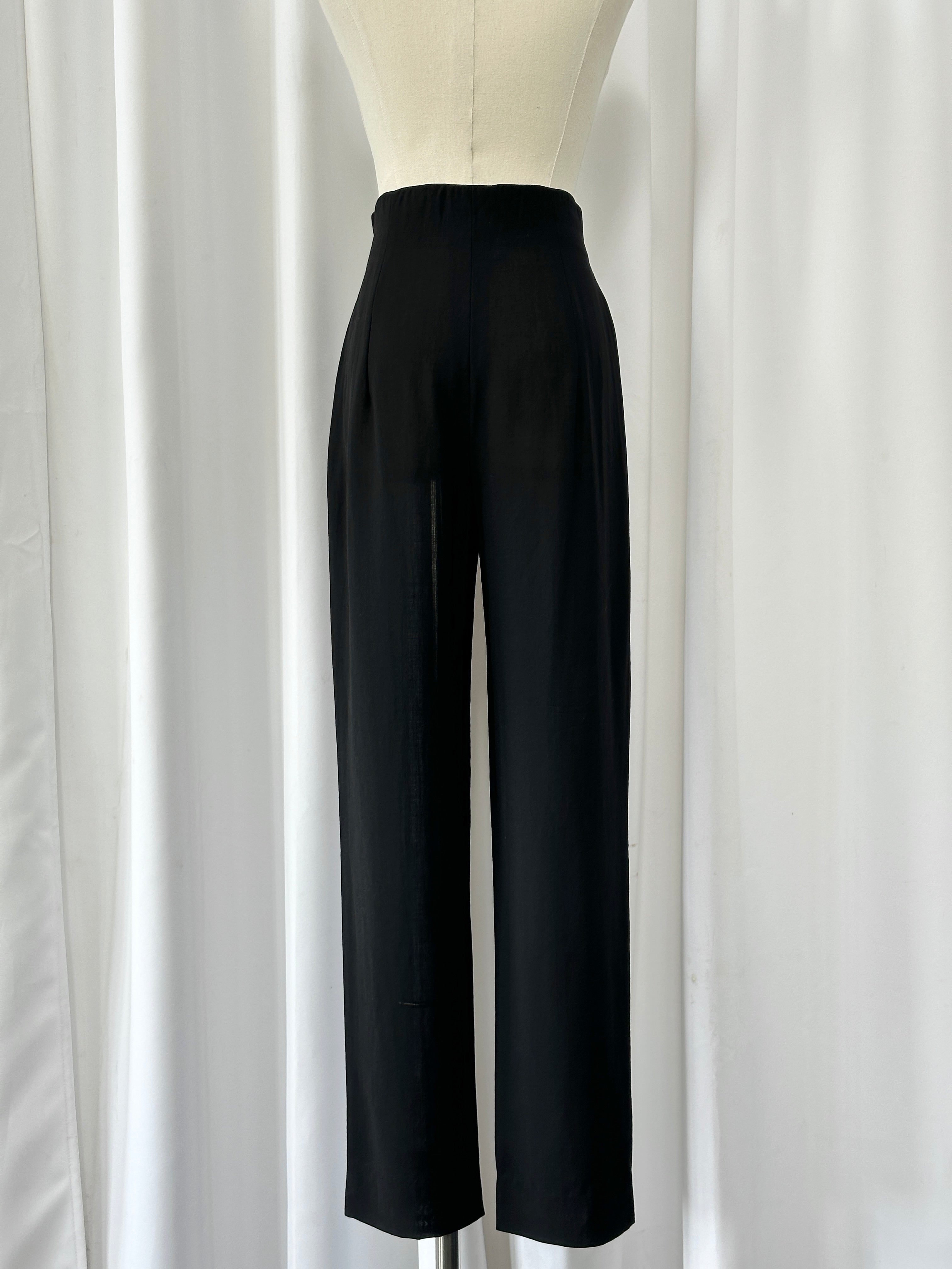 Max Mara 1990s wool high-waisted straight-leg tailored trousers in W24, shown on a model with a neutral background.