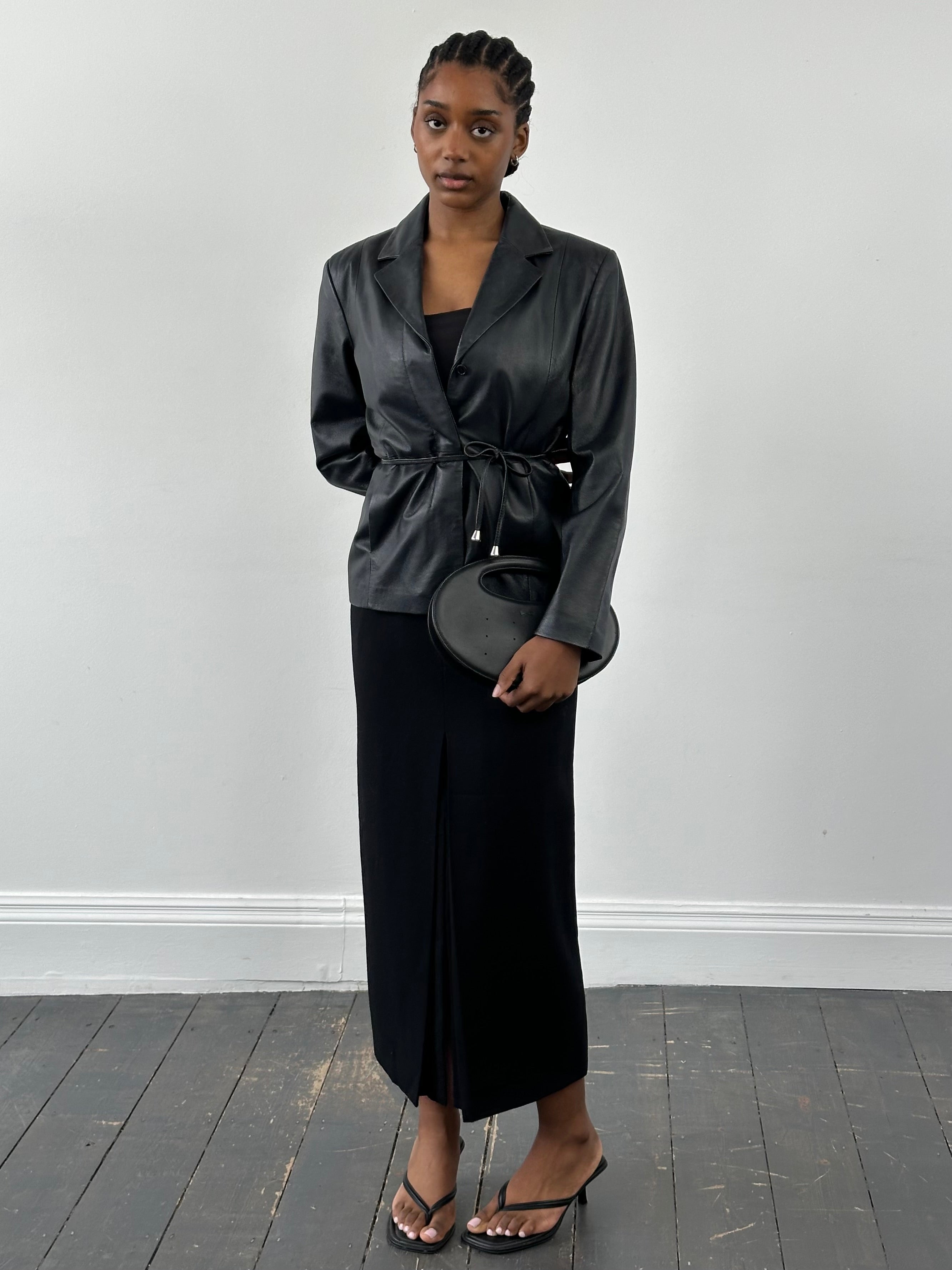 Vintage 2000s minimal leather jacket with tie belt, size small, featuring classic design and high-quality leather.