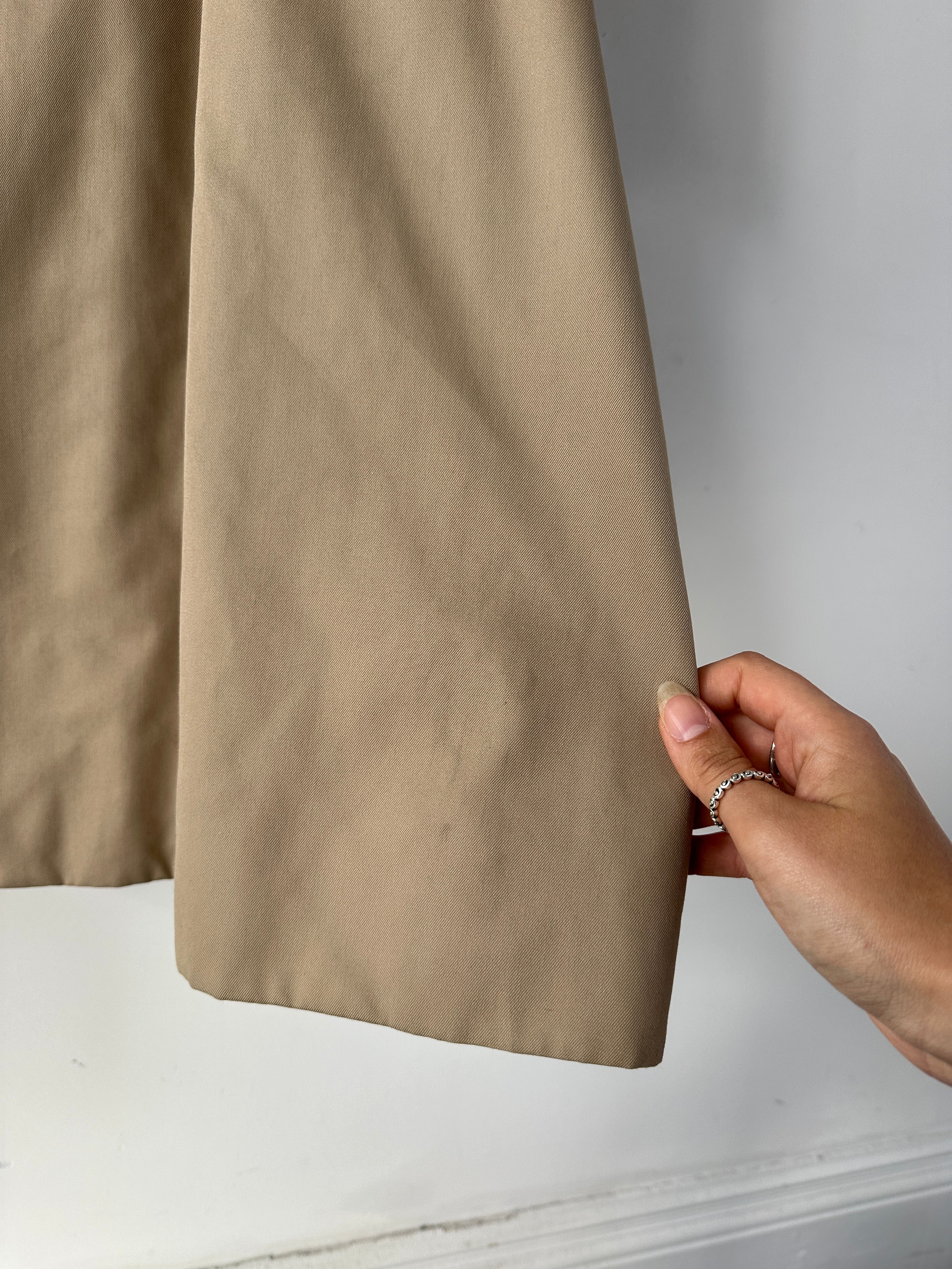Aquascutum cotton double-breasted belted trench coat in XL, gray color, displayed on a hanger with classic design details.