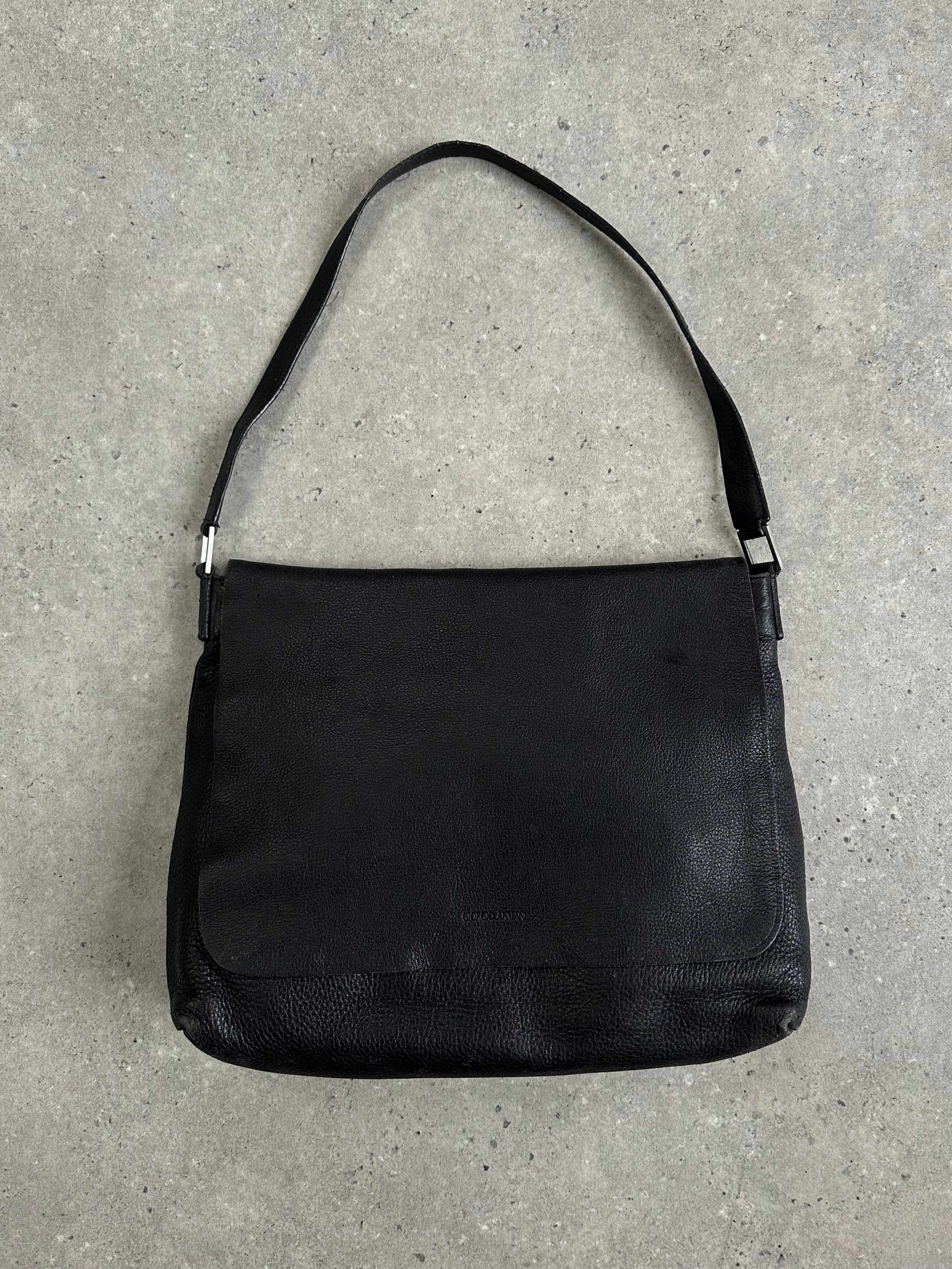Giorgio Armani 2000s leather crossbody bag with adjustable strap and classic design, featuring a sleek, minimalist look.