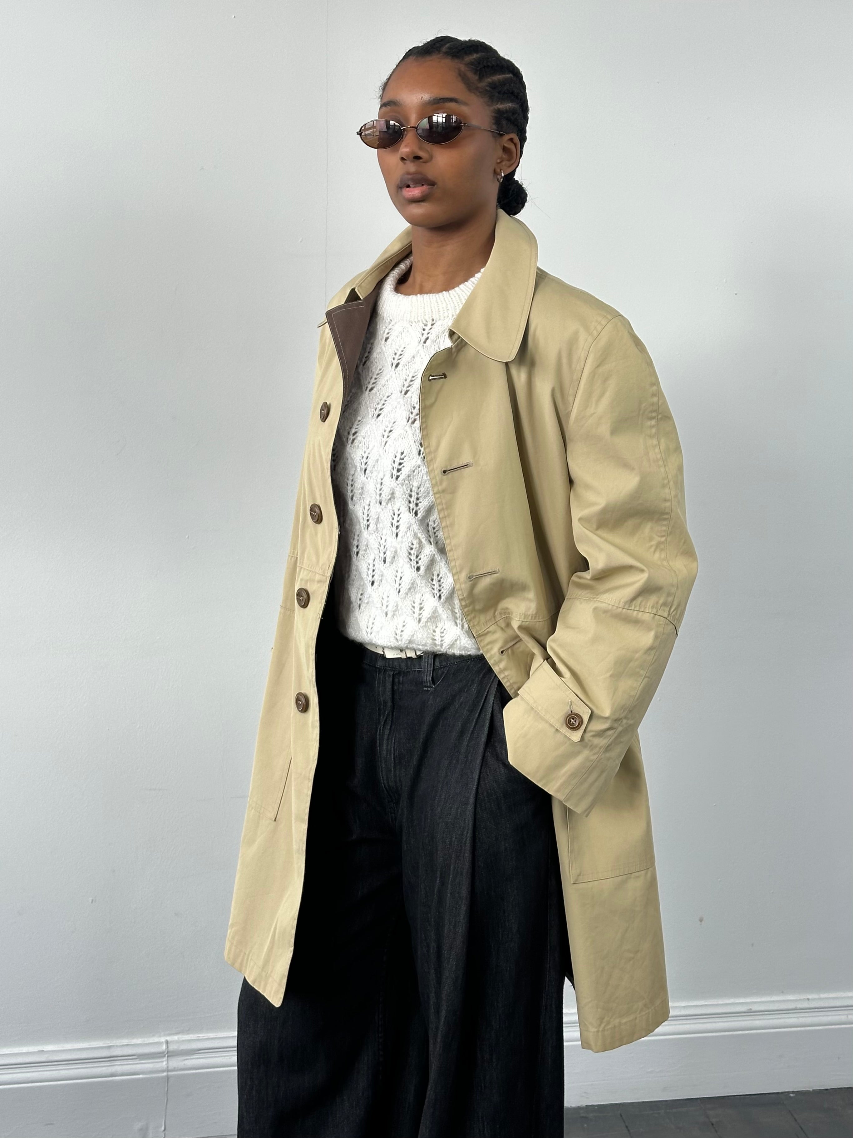 Christian Dior Paris 1980s cotton belted trench coat, stylish vintage outerwear with classic design and neutral color.