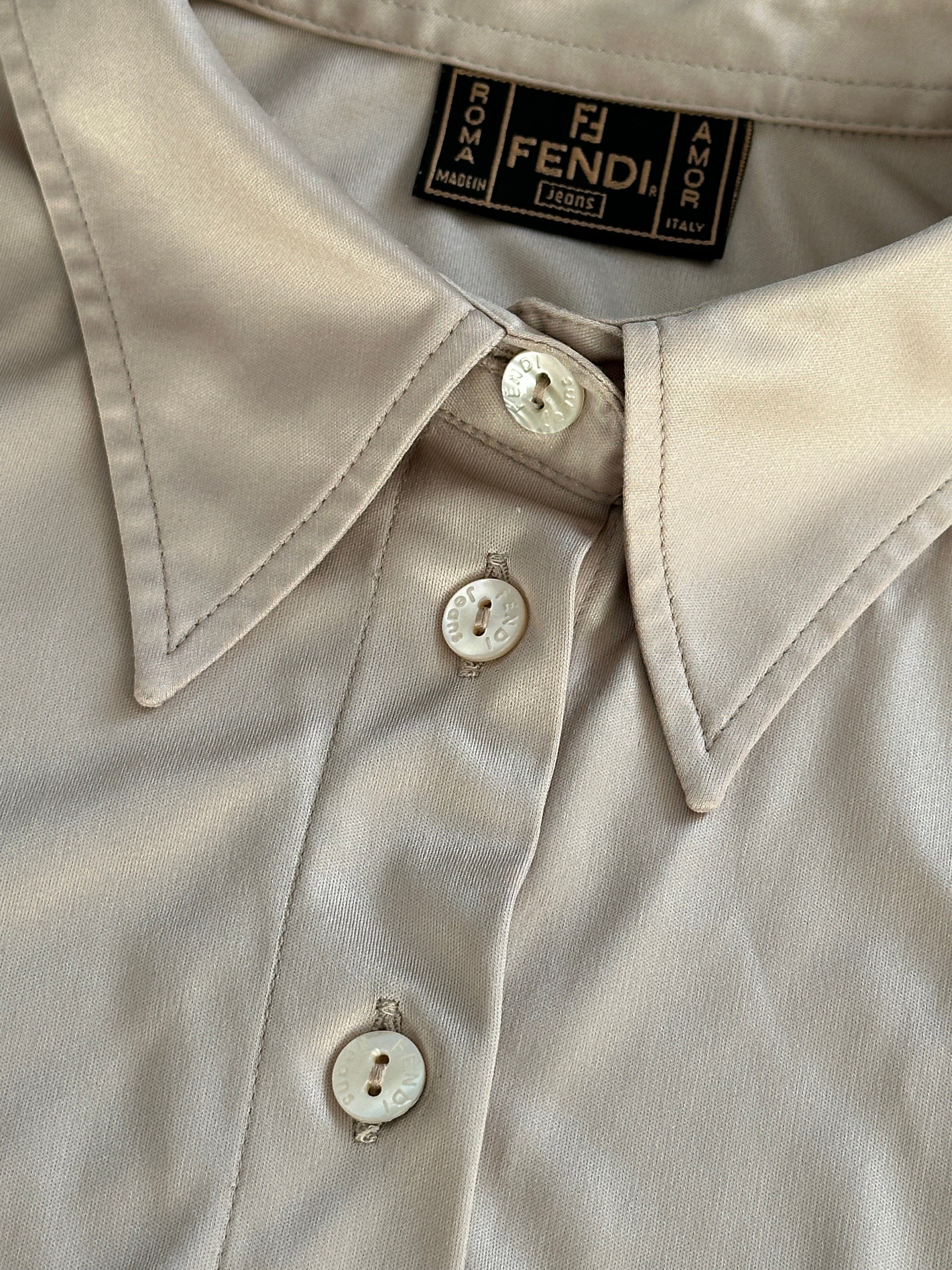 Fendi sleeveless satin logo shirt in size M/L, featuring a sleek design with the iconic Fendi logo on the front.