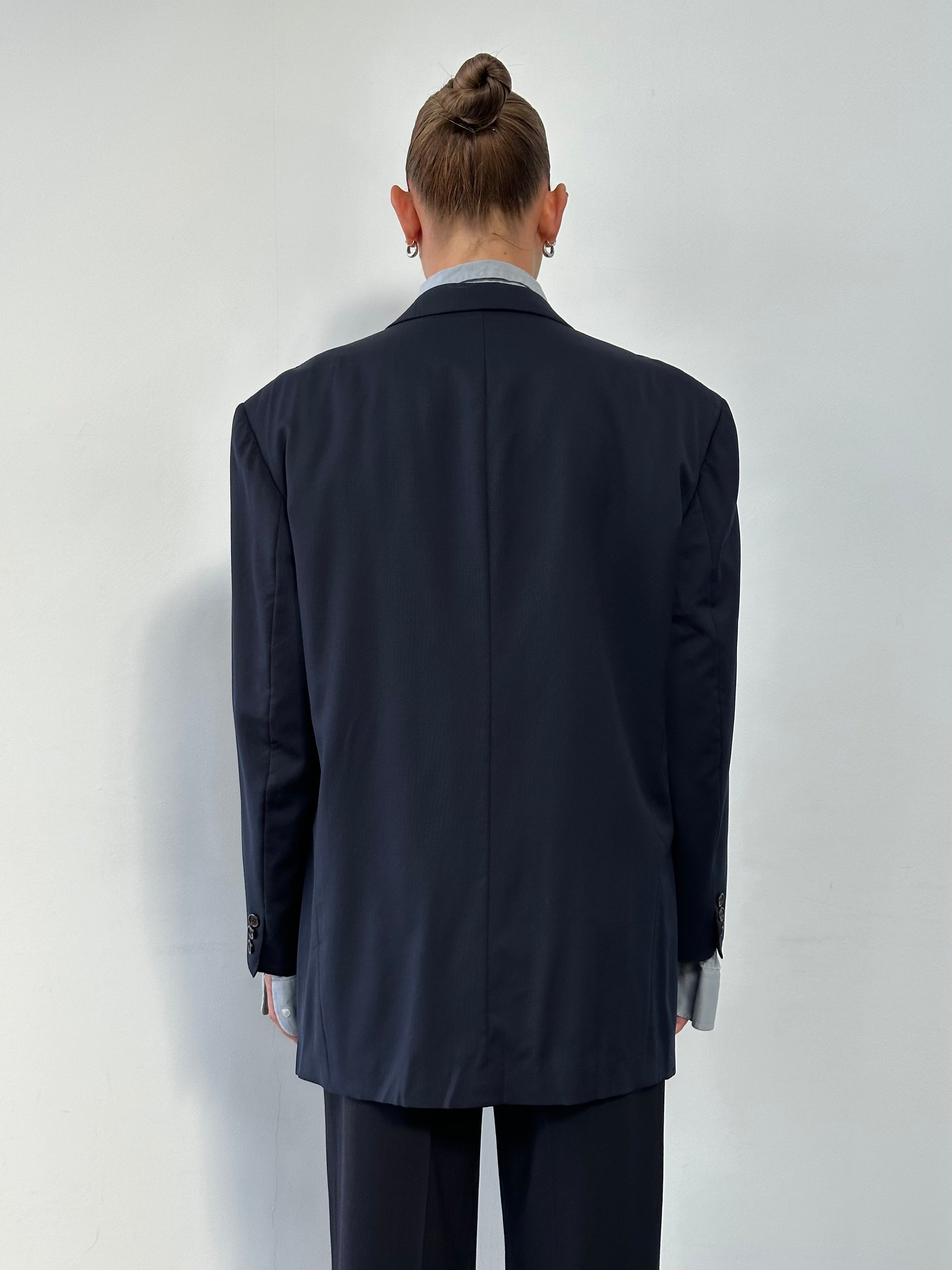 Yves Saint Laurent Pour Homme 1990s wool single-breasted blazer in size L/XL, dark color, tailored fit with lapel collar and button closure.